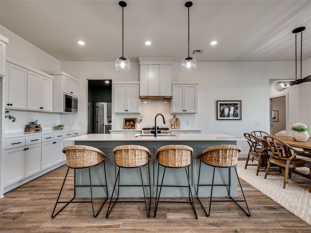 Don't settle for a NEIGHBORHOOD when what you want and deserve is COMMUNITY!  Even though Sanabria is a new addition still building out its first phase, the unbelievable community features are already in place!  Amenities include a large pool with splash pad, a clubhouse with a rec center and a gym and a large playground.  So this is the addition, now you just have to pick the right home:  One that's energy efficient, structurally and mechanically impressive, has high-quality design finishes that leave you wanting for nothing, and includes so many things that you DON'T often receive with new construction.  I think you've found it!  From the engineered post-tension foundation, Hardie Plank exterior siding and trim, high-efficiency HVAC system, tankless water heater, class 3 Impact Resistant rated roof, storm shelter, irrigation system, 2 garage door openers, full wood fence (steel posts), this is the peak of new construction without the usual "everything-is-an-upgrade" new construction experience.  The floorplan scratches the itch that the cookie-cutter homes can't.  Large kitchen with tons of storage and a huge pantry, opening perfectly to both the mudroom and the spacious living and dining spaces.  Primary suite wraps around the south side of the home, from the sprawling bed and bath suite (with massive walk-in shower and beautiful tub) that opens into the closet and connected laundry.  Two secondary beds on the first floor share a guest bath with 2 sinks and a separated bath/potty room.  Upstairs, you've got a perfectly flexible space that includes a bonus/living area, a bedroom and another full bath.  The house.  The community.  Let us welcome you home to both!