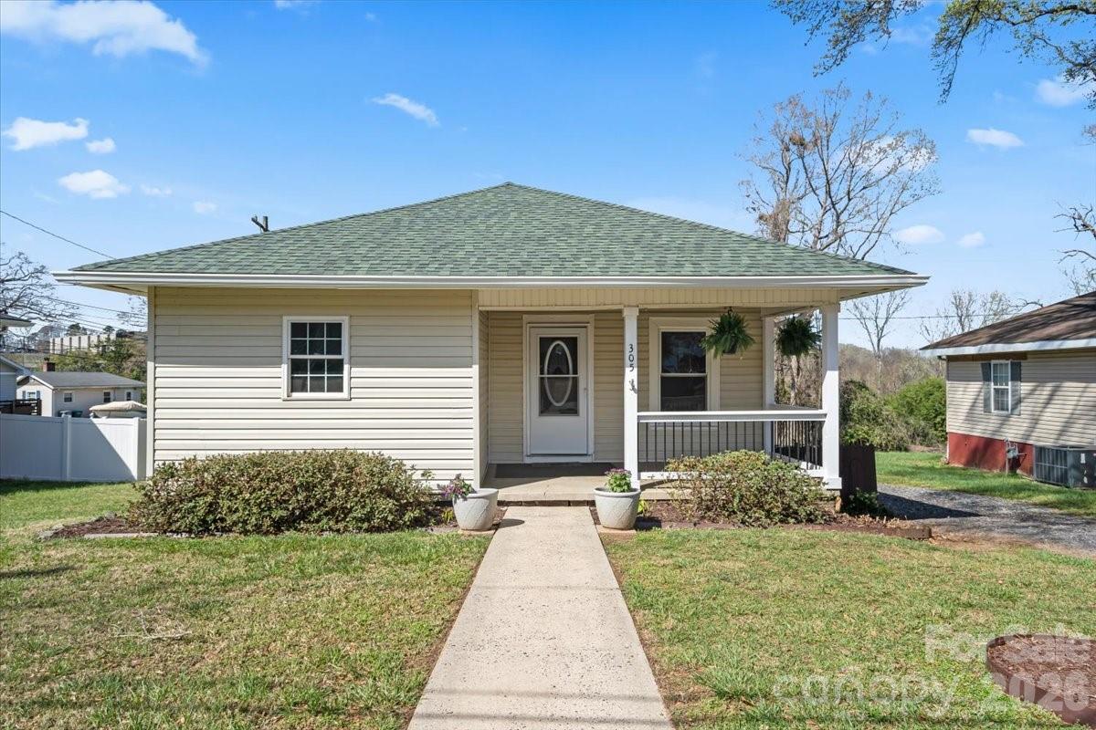 Discover the perfect blend of small-town charm and modern versatility at 305 Linestowe Drive. Located in the heart of Belmont, this beautifully maintained home offers a lifestyle of comfort and convenience, highlighted by seasonal water views of the Catawba River. Step inside to an inviting, open-concept layout designed for today’s living. The heart of the home is the bright kitchen, featuring crisp white cabinetry and a seamless flow into the breakfast area—perfect for morning coffee while looking out toward the glass doors. 2 Bedrooms, each with an en suite full bath provide peaceful and private retreats with ample natural light. Additional dedicated office space-this separate workspace is ideal for professionals working from home or for use as a hobby room. The exterior of this property is truly where it shines. Offering multiple outdoor living spaces, this home is perfect for hosting. From the upper deck with views of the river, to the expansive covered rear deck, this home is the ultimate spot for "lakeside-style" entertaining, offering a tranquil atmosphere and seasonal glimpses of the river. Step outside to your gardening haven with convenient storage and a firepit area surrounded by blossoming plants and trees. Whether you’re throwing a summer BBQ or enjoying a quiet evening under the stars, these spaces offer a private sanctuary. Located steps from the local park, rec center, and nearby public boat launch, and minutes to CLT airport, downtown Belmont and Charlotte, this prime property could be yours in time for summer!