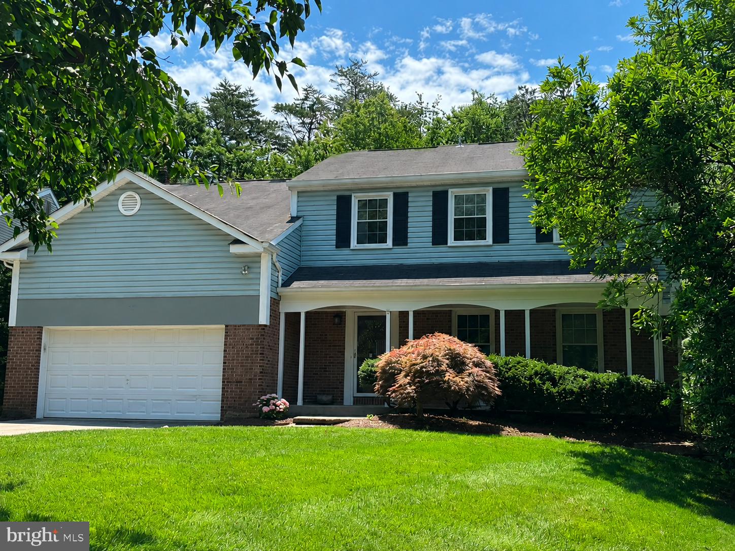 Welcome to 10711 Oldfield Drive, where your dream outdoor lifestyle comes to life! Nestled in the vibrant community of Reston, this stunning 4-bedroom, 4.5-bath home offers unparalleled access to the W&OD Trail, enveloping you in nature while still providing the convenience of nearby Sunrise Valley Elementary School. Step inside and be captivated by the spectacular three-season room, a haven of tranquility featuring elegant cedar paneling and a charming stone-faced wood-burning fireplace. This delightful space transforms throughout the year, making it perfect for entertaining friends and family or simply unwinding with a good book while surrounded by lush greenery. The main level welcomes you with hardwood floors and a seamless flow between comfortable living spaces. The kitchen, complete with a center island with bar-style seating, granite countertops, stainless steel appliances, and a wine fridge—ideal for hosting gatherings or enjoying casual meals. The family room beckons with its inviting brick-faced fireplace and direct access to the garage, while the dining room is perfectly situated for intimate dinners or festive celebrations. Step outside to discover your personal outdoor paradise! Set on an expansive half-acre lot with a new roof and driveway (2026), the meticulously designed outdoor areas include a spacious Trex deck, a tiered flagstone patio, and a fully fenced backyard that offers direct access to the scenic W&OD Trail. Upstairs, you will find brand new carpet throughout.  The vaulted ceiling primary suite serves as your private sanctuary, featuring two walk-in closets and an en-suite bath with a Jacuzzi tub, a separate shower, and dual pedestal sinks. A secondary bedroom has its own en-suite, while two additional bedrooms share a conveniently located full bath—a thoughtful layout perfect for family, guests, or remote work needs. The versatile walkout lower level adds valuable space for recreation, hobbies, or overnight guests, featuring a spacious recreation room, bonus room, full bath, and direct access to the serene backyard. With an enviable location near Dulles Toll Road, Reston Station, the Wiehle-Reston East Silver Line Metro, Reston Town Center, Multiple grocery stores, Dulles International Airport, and essential commuter routes, this home perfectly blends privacy with connectivity. Enjoy Reston Association amenities, including pools, tennis and pickleball courts, further enhancing your lifestyle.