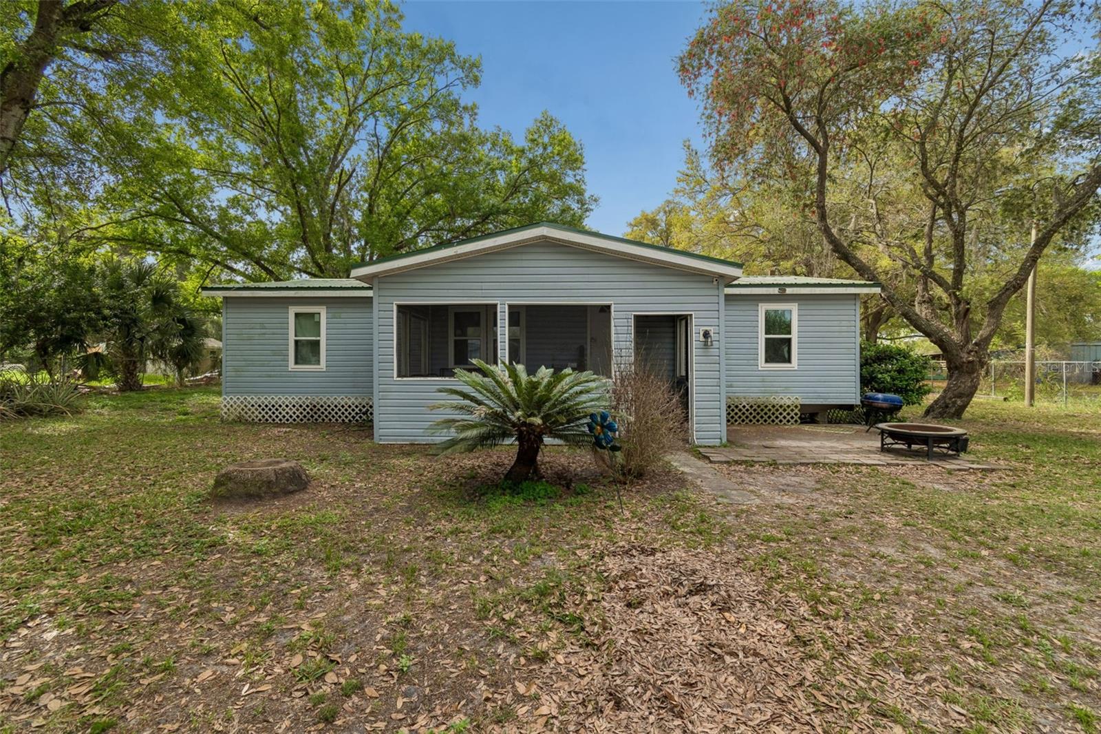 Welcome to 4505 Estate Dr, Plant City, FL 33567! This beautifully updated 3-bedroom, 2-bath plus 1 bonus room doublewide manufactured home offers 1,434 square feet of comfortable living space and sits on a spacious 0.38-acre lot fully enclosed with a chain link fence. Perfect for pets, privacy, and outdoor enjoyment.The home was remodeled in 2021 with a brand new kitchen, updated bathrooms, water heater, and upgraded electrical, giving it a fresh, modern feel. Additional major updates include a new well pump installed in 2021, a new A/C system in 2022, and new windows in 2025. The home has a durable metal roof approx. 10 years old, which adds extra peace of mind, known for its longevity and low maintenance.Inside, you'll find a functional layout with an interior laundry room and comfortable living spaces ideal for everyday living. Step outside to enjoy the large backyard with plenty of room for gardening, entertaining, or relaxing, plus a convenient storage shed for tools and equipment.With its generous lot size, numerous upgrades, and quiet Plant City location, this property is a great opportunity for homeowners or investors alike. Call today to schedule your private showing!
