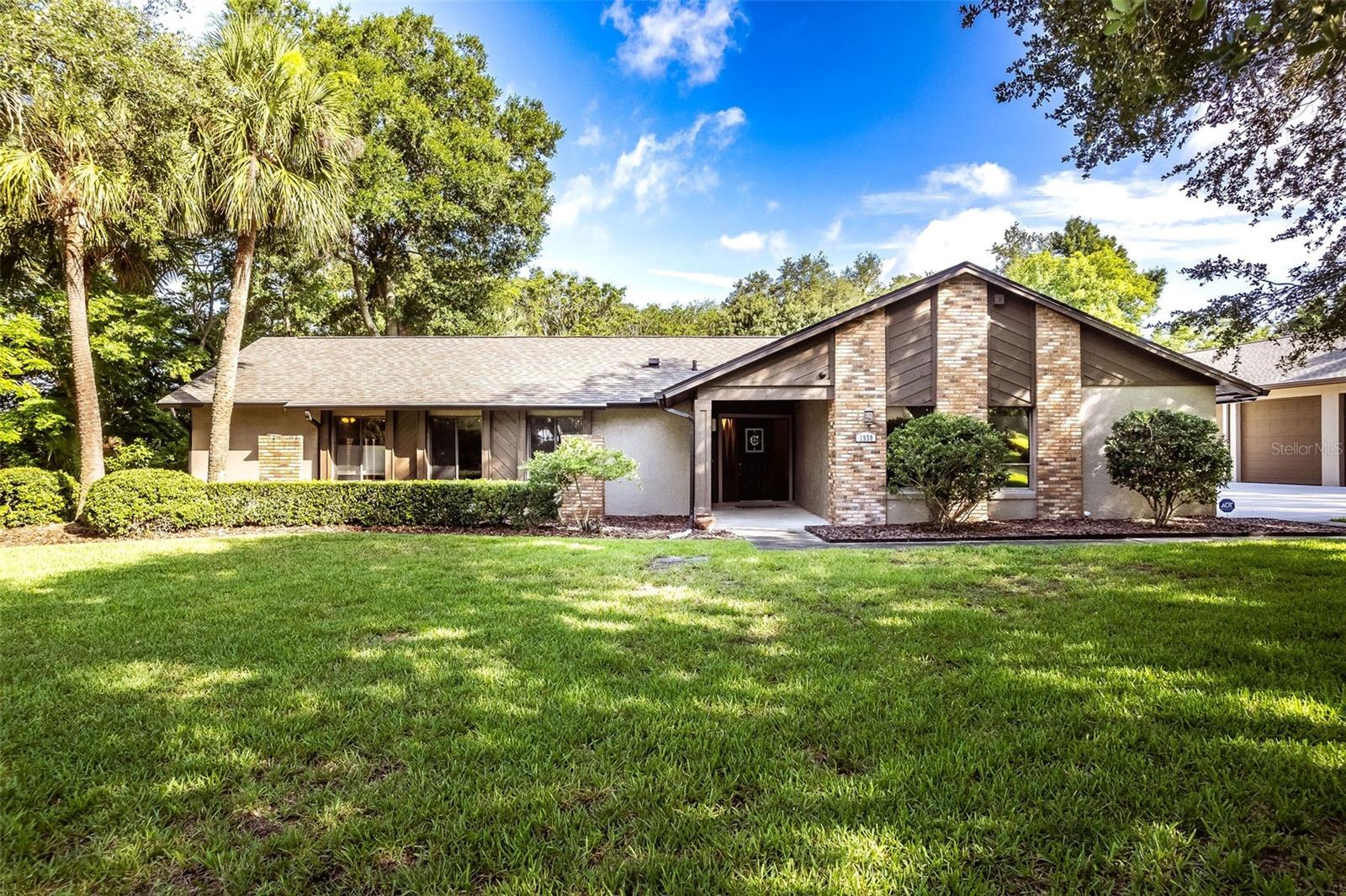 Situated on more than 1 ACRE in Longwood's desirable Mandarin community with no HOA, this 5-bedroom, 3-bath pool home offers approximately 2,700 square feet of living space along with a detached 16 CAR air-conditioned garage, perfect for any automotive enthusiast. Inside, you'll find a spacious floor plan designed for comfortable everyday living. Tile flooring flows throughout the main living areas, while the kitchen serves as the heart of the home with granite countertops, upgraded wood cabinetry, abundant workspace, and generous bar seating. The kitchen opens seamlessly to the family room, where a wood-burning brick fireplace creates a warm gathering space for family and friends. The primary suite provides direct access to the patio through glass doors and features dual walk-in closets, dual vanities, and a spacious en-suite bath. Four additional bedrooms providing flexibility for guests, a home office, fitness space, or multi-generational living. Step outside and enjoy your own private retreat featuring an oversized recently resurfaced swimming pool surrounded by an expansive paver deck. The property also includes a storage shed with a newer roof and a well for irrigation, helping maintain the grounds efficiently. What truly sets this property apart is the incredible detached, air-conditioned garage capable of accommodating up to 16 vehicles. Built for serious collectors, hobbyists, RV owners, or business owners, the structure features 12-foot ceilings, 8-inch reinforced concrete with rebar, and exceptional versatility. The driveway and RV pad were also completely rebuilt with 6-inch reinforced concrete and rebar for long-term durability. The detached garage also provides unique opportunity to generate supplemental income by renting storage space to other vehicle collectors in need of secure, covered storage. A newer 2022 roof adds peace of mind, Solar Shield throughout the Attic to assist with energy efficiency. This home is within easy reach of everything Central Florida has to offer. Enjoy a short drive to the Lake Mary business corridor, Downtown Orlando, world-renowned theme parks, and the area's beautiful Atlantic coast beaches, along with access to Seminole County's top-rated schools. Whether you're searching for room to grow, space for a vehicle collection, income-producing potential, or simply the freedom that comes with owning over an acre without HOA restrictions, this is a property that offers possibilities rarely found in today's market.