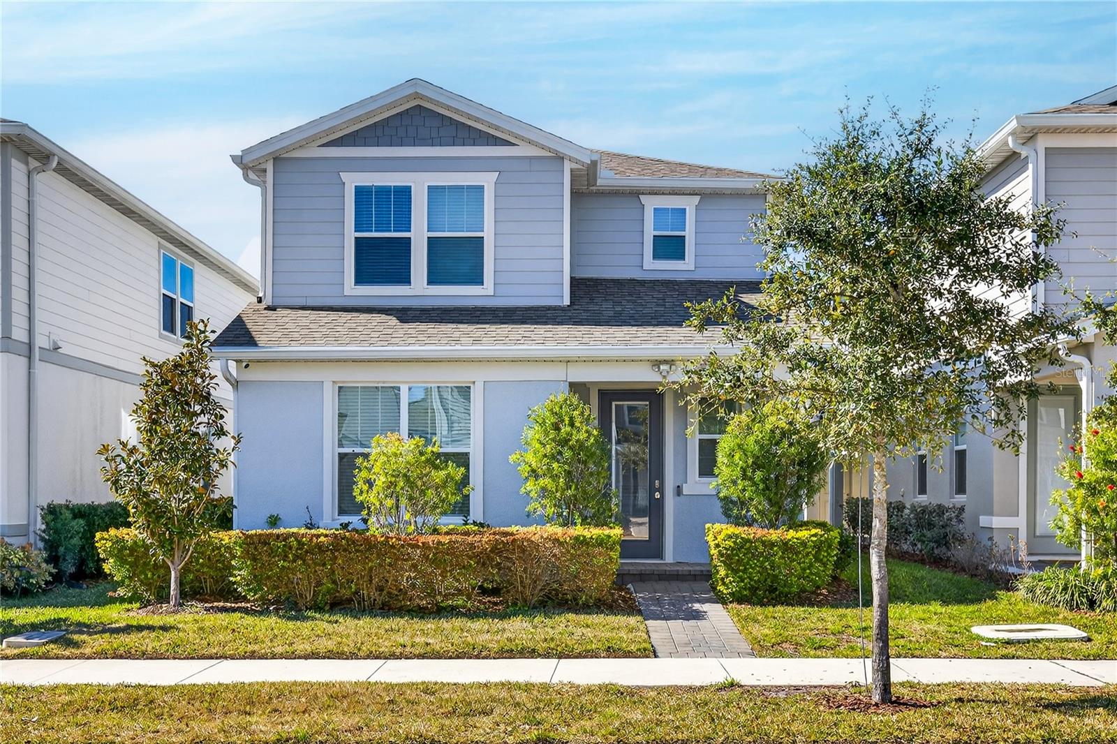 One or more photo(s) has been virtually staged. Discover the epitome of luxury and comfort in the Monterey model at Isles of Lake Nona. This home features a spacious floorplan with a welcoming foyer that leads directly to the first-floor owner's suite, which includes a double vanity, stand-up shower, and walk-in closet in the en suite bathroom. The main level is designed for entertaining, showcasing an open kitchen with 42" upgraded cabinets, quartz countertops, and wood-look ceramic tile, flowing seamlessly into the dining and living areas. Step outside to enjoy the covered lanai or access the 2-car garage with its durable epoxy floor. Upstairs, a versatile loft area—perfect for game nights—complements the additional bedrooms and shared bath, with access to a private rooftop deck. High-end finishes and smart layouts maximize comfort in every corner of this 2,191 sqft home. Additional features include a robust ADT security system with cameras, custom blinds, and all furnishings included. The 3,001 total sqft also includes exterior weatherproofing for enhanced durability and low maintenance. Community amenities offer a resort-style pool, clubhouse, sports courts, and more, all secured by a gated entrance. Pre-wired for smart technology and connected to a gigabit fiber network, this home is ideally situated minutes from Medical City, Lake Nona Town Center, and local attractions. Experience the vibrant lifestyle of Lake Nona in this stunning residence.