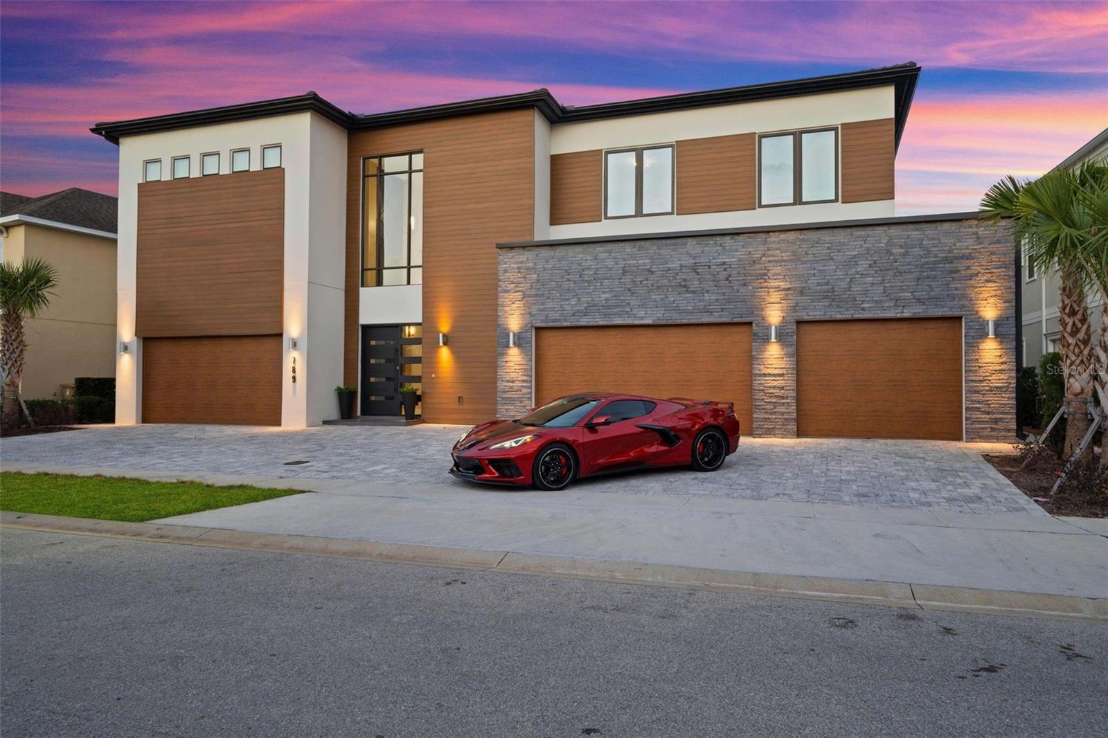 PRICED BELOW APPRAISED VALUE! Presenting a premier turnkey investment opportunity with this fully furnished 10-bedroom, 9.5-bathroom custom luxury home in the world-renowned Reunion Resort. Purpose-built to deliver exceptional short-term rental performance and expertly designed to maximize occupancy and guest satisfaction, this premium property features four lavish owner suites with three main floor king suites and seven additional suites upstairs highlighted by three dynamic interconnected themed bunk bedrooms consisting of a Harry Potter themed room with three bunk sets, a Star Wars adventure bunk room, and a Cinderella fantasy suite with a Pumpkin Carriage bed. Many outstanding features set this home apart from the ordinary including two whimsical converted garages - one transformed into an interactive Toy Story-themed activity room with a ball pit, slide, wall mounted Scrabble board, Nintendo Switch and Life Sized Etch-A-Sketch TV - the second features a drive-in style arcade complete with a classic hot rod convertible, food truck trailer turned gaming station, Skee ball, dual Batman racing machines and a basketball shooting game. Additional amenities include multiple lounging areas, a rare 22-seat surround-sound theater and an upstairs gaming loft with a wet bar, billiards, card table, arcade style video games and large screened balcony overlooking the pool and golf course. The fully equipped kitchen with premium appliances, and a center island with bar top seating seamlessly connects to the spacious living and dining areas ideal for hosting large groups or cozy enough for intimate gatherings. Outdoors, guests enjoy a private resort-style oasis backing to the golf course with a covered lanai, summer kitchen, expansive paver deck with numerous chaise lounge chairs. The heated pool has a spa, sun shelf, swim up bar with pedestal seats and a multiple person in pool table top. Offered fully TURNKEY and ready to generate immediate income it also comes with a valuable Reunion Resort MEMBERSHIP that provides access to three signature golf courses, twelve pools, tennis and pickleball center, miniature golf, dog park, day spa, fitness center and more....With its unmatched combination of themed experiences, high-end designer finishes, rental quality furnishings and close proximity to Central Florida’s attractions, world class dining, shopping, and entertainment, this property offers a top-tier luxury lifestyle and a high-performing short-term rental opportunity making it a solid addition to any investment portfolio or an enduring vacation retreat. Check out the cinematic video - https://vimeo.com/1039017427/20adec1455