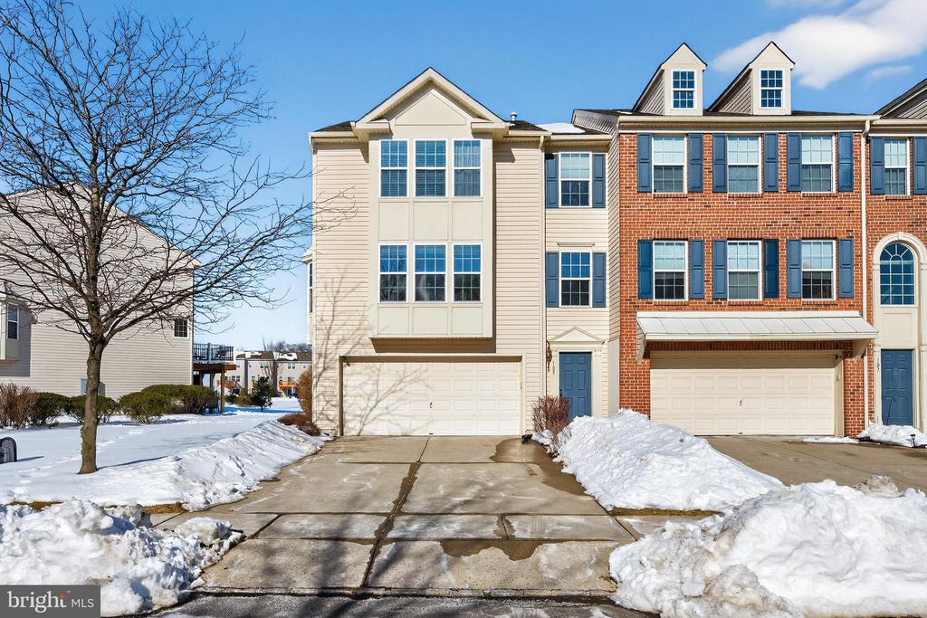 Don’t miss this rare opportunity to own an end-unit townhome in the highly sought-after Cinnaminson Harbour—just steps from the Delaware River! This sun-filled home offers versatile living space across three levels. As you enter, you’re greeted by soaring ceilings, fresh neutral paint, and wide-plank, high-end vinyl flooring that creates a clean, modern feel. The lower level features a flexible bonus space—perfect for a home office, media room, or playroom—with double sliding doors that open to your own private patio. Upstairs, the heart of the home shines with a bright, open main level offering spacious living and dining areas and a kitchen designed for entertaining. Highlights include cherry cabinetry, granite countertops, stainless steel appliances, and a generous island with bar seating. A butler’s pantry provides additional prep and storage space, while French doors lead to a private balcony—ideal for morning coffee or evening relaxation. The top floor boasts three spacious bedrooms. The primary suite has an oversized walk-in closet and a luxurious ensuite bath. Unwind in the deep-soaking tub or the tiled walk-in shower. Two additional bedrooms, each equipped with a ceiling fan and a large closet, along with a full hallway bath, provide comfortable accommodations for guests or family members. The conveniently located upstairs laundry closet means no more hauling laundry up and down stairs.The attached two-car garage easily accommodates vehicles while still providing ample storage space. Residents enjoy access to private, resort-style community amenities, including a clubhouse, fitness center, swimming pool, tennis courts, dog park, fire pits, and scenic riverfront walking paths. Commuters will appreciate quick access to Route 130, the NJ Transit River Line, and close proximity to both Philadelphia and Trenton. Homes in this desirable community don’t come along often. Schedule your private showing today and discover why so many are proud to call Cinnaminson Harbour home.