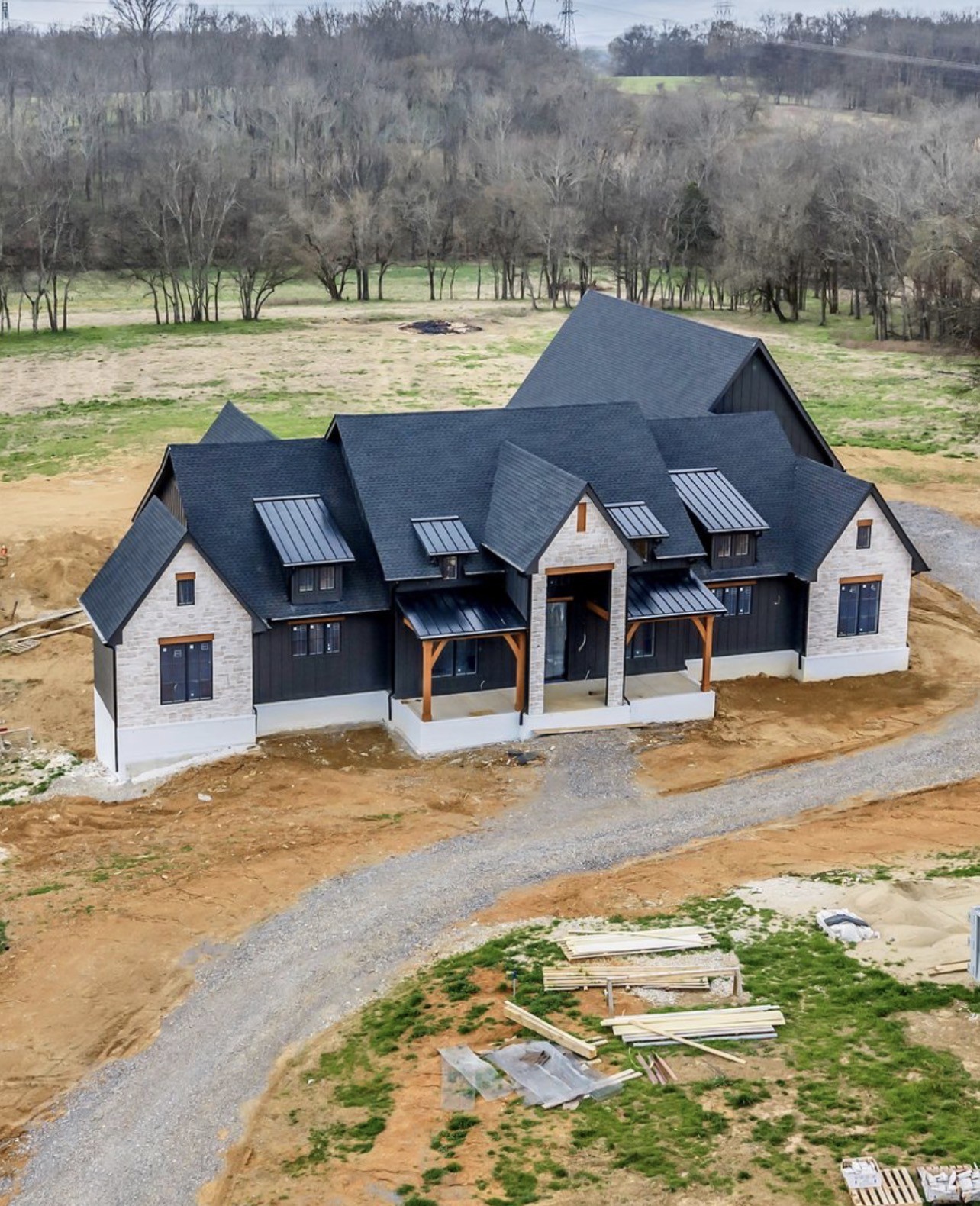 Completion date this year! 25 mins to Leipers Fork! 10 mins to Target! 30 mins to downtown Franklin!  This extraordinary estate redefines luxury living on 9 pristine acres, offering more than 9,900 sq ft of perfection. Crafted with an uncompromising eye for detail by This Blue Home Designer Vicky Blue and masterfully built by Alpine Construction Group LLC, this residence is destined to be one of the area’s most iconic homes.From the moment you enter, this home reveals its grandeur: soaring ceilings, All-Clad windows that frame sweeping views of the countryside, a gourmet culinary space outfitted with custom cabinetry, Wolf & Sub-Zero appliances, and the finest designer finishes. Every inch exudes sophistication.The home is elevated by a fully integrated Lutron smart-home system, an immersive entertainment package. The walkout basement offers 10'+ ceiling and is designed from top to bottom with your family's needs in mind.4 bedrooms with main level living plus office. An expansive upper bonus room/ workspace including full bath and walk in closet. The basement could serve as another house, multi-generational living or simply room to spread out! Separate entrance, 1 bedroom on-suite, kitchen, 2 living spaces a large laundry and wellness space. Soooo much storage and a theater room or simulator space/ man cave... This is more than a residence—it’s a legacy property. Do not miss the opportunity to choose final details. More acreage may be available. Plenty of room for animals and pastures. A great little creek runs near the back of the property. Not in flood zone.
