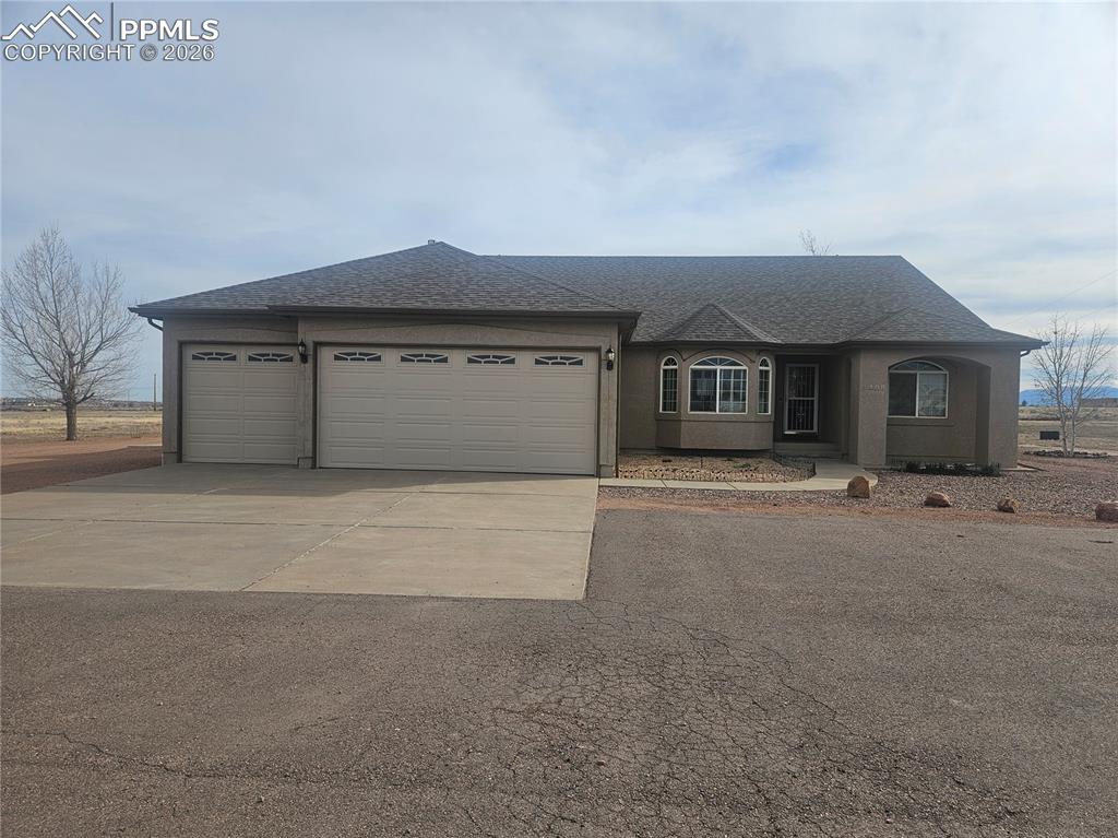 Beautiful North Pueblo West Rancher. This home hosts 3,976 sq ft with 5 bedrooms and 3 bathrooms located on two lots on 5.52 acres. The main level is home to 3 bedrooms, 2 bathrooms, the kitchen, laundry room, dining room and living room. The kitchen has tile floors throughout, stainless steel appliances, granite countertops, granite backsplash, a stand alone island and a large bar top. The primary bedroom is open with south facing windows for an abundance of natural light. The large attached primary bathroom has a dual vanity with granite countertops, tile floors throughout, a walk-in closet, walk-in shower and jetted tub. The basement is home to two more bedrooms, a full bath, the large family room and dry bar. The backyard is fully fenced with a large covered patio and open side patio perfect for entertaining all you guests. The 48'x30' shop has electricity and plenty of space for all of your toys. The home also includes 30 solar panels that are paid off and will transfer to the buyer at closing. The furnace and central air unit were replaced in 2022. The hot water heater was replaced in 2023. This home has so much to offer, you do not want to miss out on this one. Lot next to home included in sale.