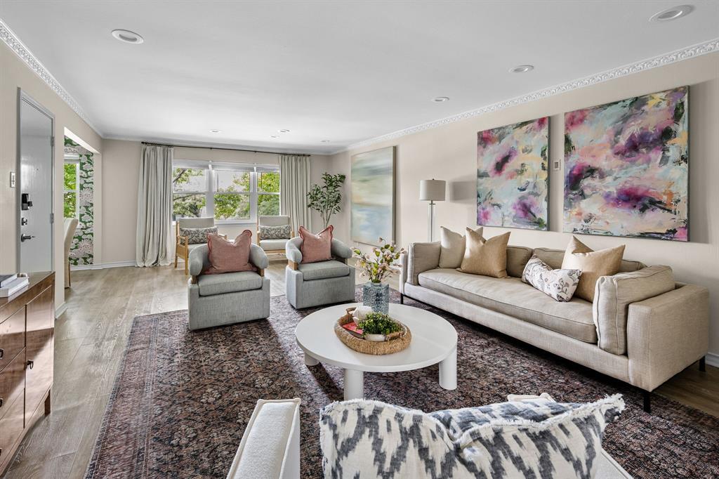 Located behind the Pink Wall, this beautifully finished 2-bedroom, 2-bath residence combines timeless style with modern upgrades in one of Dallas’s most desirable enclaves. Step inside to find thoughtfully curated designer touches throughout, including Thibaut and Anna French wallpapers. The spacious living room offers serene treetop and pool views framed by newly installed windows, creating a bright and inviting atmosphere. The well-appointed updated kitchen features honed countertops, ample storage, custom cabinets, a Bosch dishwasher, and a Samsung Bespoke refrigerator. Retreat to the elegant primary suite featuring Masland wool carpeting and a beautifully updated bath with a frameless shower and an LG Inverter Drive washer-dryer tower. The secondary bedroom includes its own ensuite bath accented with Ann Sacks Craze tile. Natural light and stylish details create a warm, inviting feel, perfect for both everyday living and entertaining.