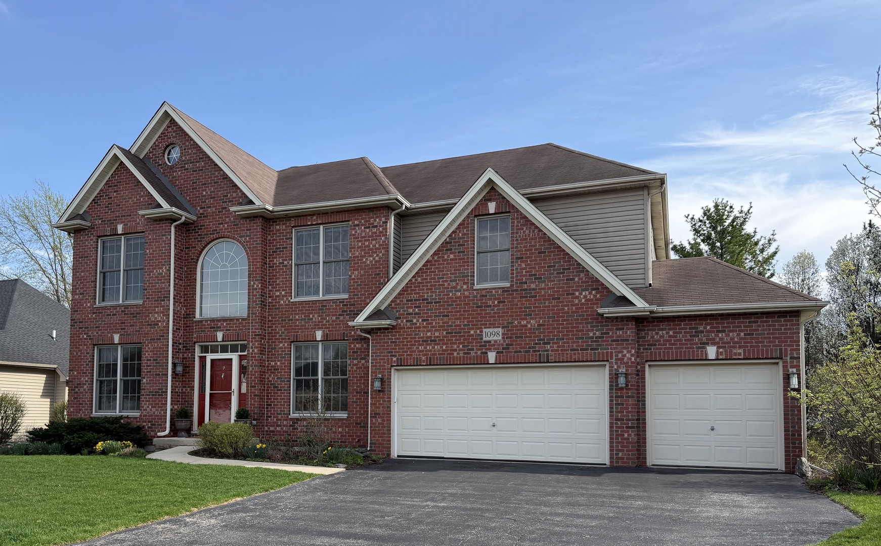 First time on the market, this custom R. A. Faganel home offers over 4,000 square feet of finished living space designed for a flexible, modern lifestyle. The heart of the home features a chef's kitchen with a granite island that opens directly into the family room, while a separate, large formal dining room is ready for holiday gatherings. Vaulted ceilings and a stunning floor-to-ceiling fireplace create an inviting atmosphere, complemented by a private main-floor office. The entire level flows seamlessly to a deck overlooking a gardener's paradise-a private, fenced oasis with vibrant perennials and established raised garden beds. The master suite provides a quiet retreat with a soaking tub, double sinks, a remodeled shower, and an oversized walk-in closet. Designed for true multi-generational living or guest privacy, the finished walk-out lower level includes a separate patio entrance and a second sun-drenched family room. The fifth bedroom and full bath featuring a heated floor offer the perfect setup for extended family or can double as a quiet second home office. Meticulously maintained with a three-car garage and HEPA filtration, this home is perfectly situated just one house from H. Michael Wild Park and near the Illinois Prairie Path.