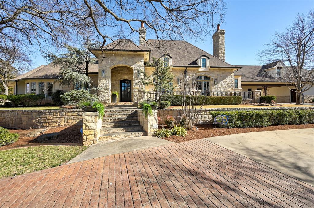 This exceptional home at 2204 Catalina Drive stands as one of the most distinguished properties in the exclusive gated community of the Edgewater Subdivision. Sitting on a corner lot, this meticulously crafted custom home was built by Doug Poff Homes and completely remodeled in 2022.  Combining timeless architectural details with premium finishes such as walnut and limestone flooring, expansive living spaces, finely appointed custom cabinetry, and fixtures, a steam shower, a custom-designed wardrobe suite with floor-to-ceiling handcrafted cabinetry, and a safe room built to withstand an F-4 storm, cleverly integrated into a beautiful climate-controlled wine room. This resort-style outdoor environment flows naturally from the interior living areas, perfect for both large gatherings and quiet family evenings.  Designed for entertaining and relaxation, the outdoor spaces are superb.  Newly built 2000 sq ft pool house boasts a full kitchen, full bath, workout facility, and a turfed batting cage.