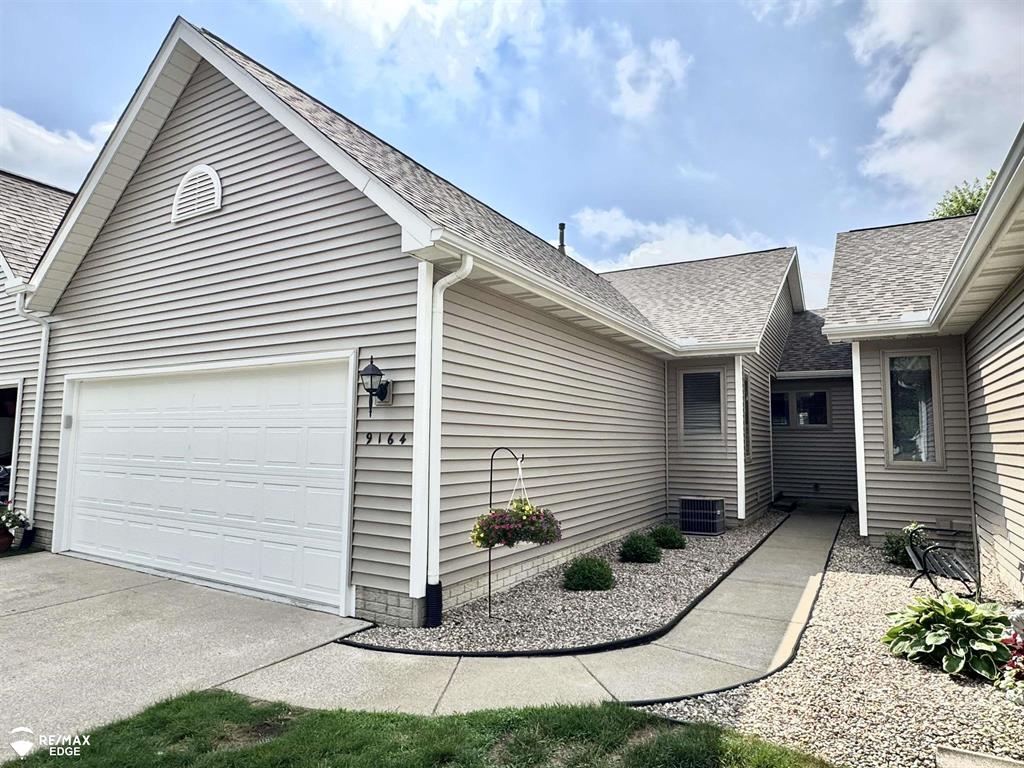 Ideal ranch style condo. Move in ready! Enjoy low-maintenance living in this beautifully updated ranch-style condo located in the highly sought-after Nature View community. Thoughtfully designed for comfort and ease, this home features a vaulted great room filled with natural light and an open-concept kitchen complete with an island, full appliance package, and french doors leading to a private deck with green space views-perfect for morning coffee or evening relaxation. Two generously sized bedrooms and two full bathrooms on the main level include a private primary suite. The first-floor laundry room adds convenience with upper cabinetry for storage. The finished lower level expands your living space with a bar, kitchenette area, a home theater setup, and a third full bathroom-ideal for hosting guests or creating your own retreat. Enjoy the benefits of condo living with exterior maintenance, snow removal, and lawn care, water all handled for you. Recent updates in 2024 include a new roof, siding, gutters, garage door, and opener. Fresh landscaping, a two-car attached garage, pet-friendly environment, and a prime location close to shopping, dining, and everyday essentials make this home an easy choice.