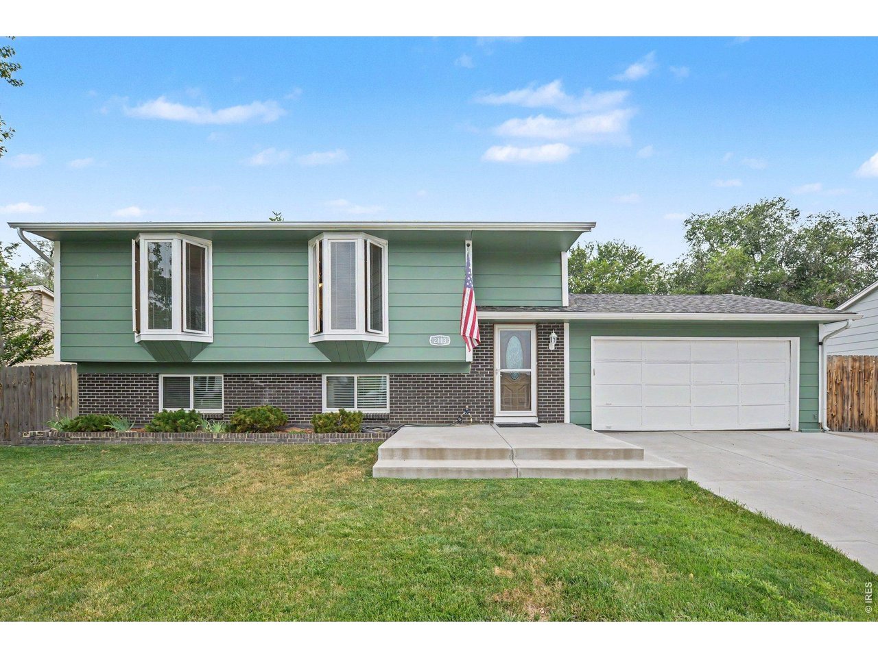 Welcome home to this beautiful property situated on a large, fully fenced lot! Enjoy the inviting front patio, brand-new oversized back deck, and private hot tub.Inside, you'll find an updated kitchen with stainless steel appliances, a bright and inviting interior with light, natural paint tones, and a cozy wood-burning stove in the recreation room. The rec room also features a convenient bar area, creating the perfect space for gatherings and entertaining.The oversized garage provides plenty of room for vehicles, toys, storage, or a workshop. Located close to parks, shopping, and everyday amenities, this home offers comfort, space, and convenience all in one!