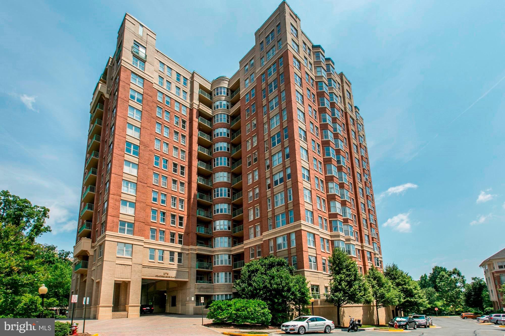 Welcome to luxury living in the heart of Reston! This beautifully updated 2-bedroom, 2-bath high-rise residence at Stratford House Place, a full-service concierge building, offers the perfect blend of modern comfort, elevated style, and unmatched urban convenience in one of Northern Virginia’s most dynamic and evolving communities. Step inside to discover a spacious, open-concept layout featuring rich hardwood floors and soaring ceilings that create a bright, airy ambiance. Expansive glass sliding doors fill the home with natural light while offering a refreshing breeze and stunning panoramic skyline views. The well-appointed kitchen is designed to impress, complete with premium GE Monogram appliances, granite countertops, and generous storage. Both oversized bedrooms provide ample closet space, while the two bathrooms have been tastefully refreshed with a clean, modern aesthetic. Whether you're preparing a gourmet meal, unwinding the fireplace, or hosting guests against a backdrop of sweeping views, this home delivers comfort and sophistication at every turn. Located in Reston Town Center, you’re just steps from premier dining, shopping, entertainment, and Metro access—while also moments from the rapidly expanding Reston Station district. This vibrant, transit-oriented urban hub is directly connected to the Silver Line and features a dynamic mix of luxury residences, Class A office towers, retail, restaurants, fitness, and entertainment—all designed around a walkable, community-centric environment.  Enjoy access to exciting new destinations including the Reston Row and emerging RTC West corridor, home to the newly opened JW Marriott, elevated dining experiences, outdoor gathering spaces, and year-round events on the plaza—from fitness classes to live entertainment.  Whether you're commuting, traveling via Metro to D.C. or Dulles, or simply enjoying the energy of a growing urban center, this location offers unparalleled connectivity and lifestyle appeal. This is urban living at its finest—where luxury meets location and everything continues to grow around you.