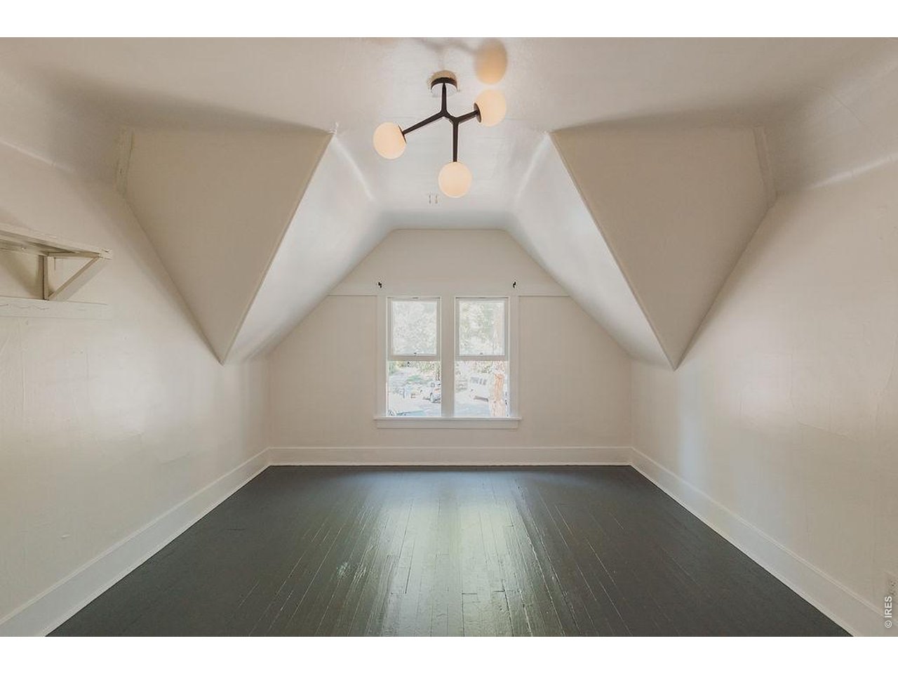 Charming two-story brick bungalow on coveted South Meldrum, just steps from Colorado State University. This one-of-a-kind home offers more than 2,500 finished square feet, five bedrooms, and two and a half bathrooms in one of Fort Collins' most sought-after locations. The main level is filled with character and natural light, featuring soaring 9+ foot ceilings, beautifully refinished hardwood floors, an updated kitchen with new flooring, two secondary bedrooms, a full guest bathroom, and a dedicated primary suite-a truly rare feature at this price point and location.Upstairs, you'll find two additional bedrooms, a convenient half bath, and two generous bonus storage areas. The newly finished basement adds valuable living space with new drywall, new flooring, and a new egress window, creating endless possibilities for a family room, guest space, office, or recreation area.Extensive recent improvements include fresh interior and exterior paint, refinished hardwood floors, front porch tuck-pointing, updated flooring, new lighting, and numerous thoughtful updates throughout.Renovated and thoughtfully designed by Emily Heinz and Trinity Wilbourn of Downtown Real Estate, this exceptional home blends timeless character with modern updates. Enjoy an unbeatable location just moments from CSU, Downtown Fort Collins, and the Laurel Street shops and restaurants.