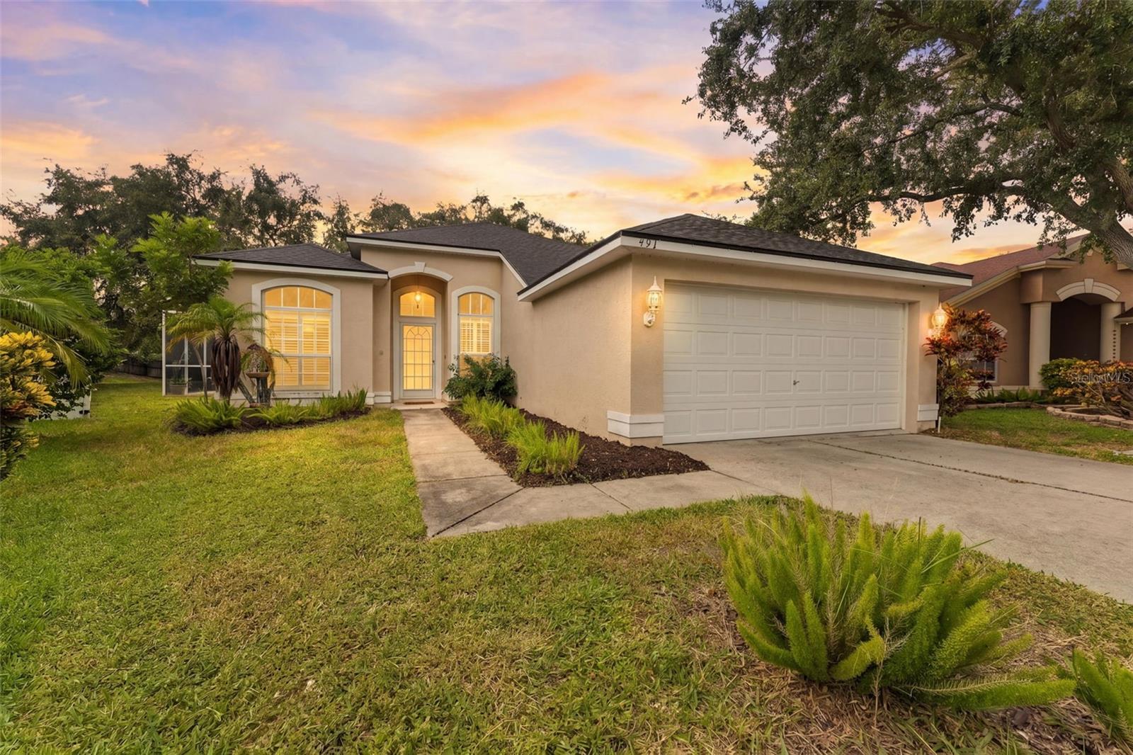 Ready to live your best Florida life? Welcome to 491 Briland Street, a beautifully maintained 3 bedroom, 2 bathroom pool home in Tarpon Springs. From the moment you arrive, you will notice how exceptionally clean and well cared for this home is. Plantation shutters on the front windows add timeless style, privacy and a polished finishing touch.Step inside to a bright, welcoming floor plan designed for comfortable everyday living. The kitchen offers abundant cabinetry, stainless steel appliances and plenty of workspace, with an open connection to the surrounding living and dining areas. There is room to gather with your favorites, while still feeling cozy enough for a quiet night at home.Now let’s talk about the outdoor space! Open the sliding doors and step into your own Florida retreat. The large pool is surrounded by an oversized screened enclosure, giving you plenty of room to swim, relax and entertain. The covered lanai provides a shaded spot for morning coffee, outdoor dining or unwinding at the end of the day. This is the kind of space you will enjoy throughout the year.The home also includes a 2 car garage and two important updates buyers will appreciate: a NEW ROOF completed in 2026 and an air conditioner installed in 2021.Located in Tarpon Springs, this home puts you close to the relaxed Gulf Coast lifestyle the area is known for. Whether your perfect Florida day includes time by the pool, exploring the community or heading toward the water, this clean and inviting home is ready for its next chapter. Come see it for yourself!