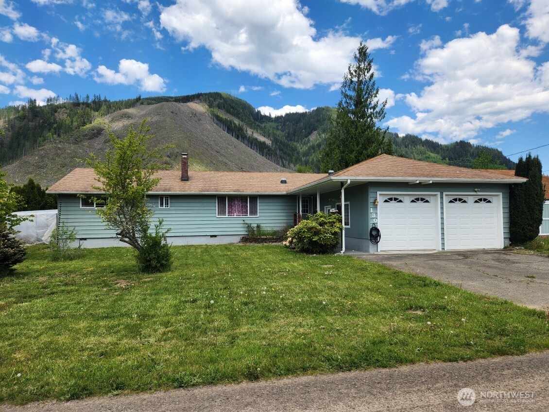 This 4-bedroom, 1 & 1¾ bath, spacious corner lot residence sits on 1/3 acre, offering privacy & convenience. Inside discover an open concept living space, a bonus room for a possible library, craft or playroom, and an updated kitchen with modern appliances & pantry. The house uses a heat pump for heating/cooling with air purification plus wood stove for cozy winters. Enclosed deck with separate enclosed patio allows for year-round comfort outdoors. Tuff shed with loft, tool shed, green house with power, 2 car garage with fresh epoxy floor, RV hookup and additional parking. Just minutes from town, near schools, shopping, Post Office & Hwy 12, this property is a must-see for comfort, space, & access to outdoor activities in a serene setting.