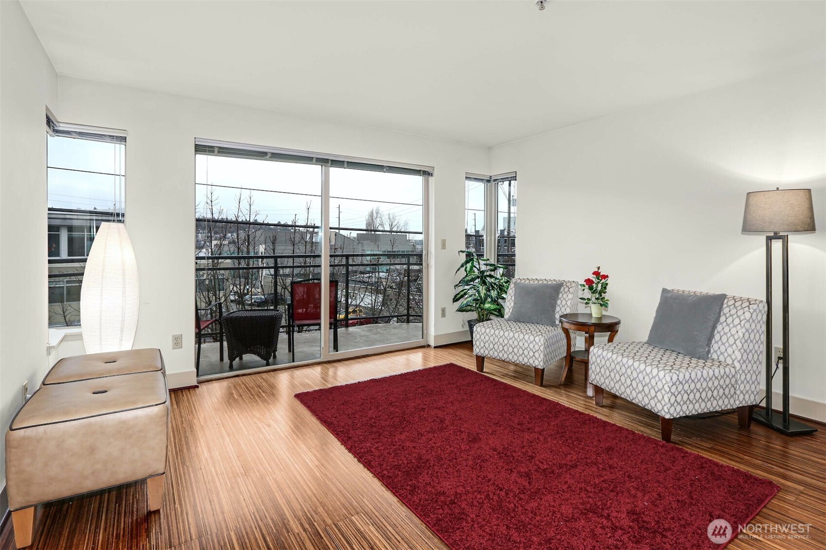 Very Motivated Seller. This home offers modern urban flair with roomy & comfortable spaces. Enjoy Western city & lake views from the spacious balcony & from each bedroom. The kitchen is accentuated w/stainless appliances, custom cabinetry & a convenient eating bar. The great room boasts large west facing windows for a bright airy feeling. Plus there is bamboo flooring throughout the unit. This home features 2 BR suites each with a full bath & large closets. There is a large in-suite laundry room featuring full size washer & dryer, utility sink & extra storage cabinets. Don't miss the huge entry storage closet. Plus, there is an additional private secure storage locker on the secure garage level. Minutes to Lake Union, groceries, bakery, coffee and so much more. Must show to appreciate the great location and the value of this property. Ideal location near S Lake Union Tech Ctr, U District, Downtown, Seattle Center, Capitol Hill & Queen Anne. Minutes to Great restaurants & shopping. EZ freeway and transit access. Secure garage parking. No rental cap. Seller has paid the assessment.