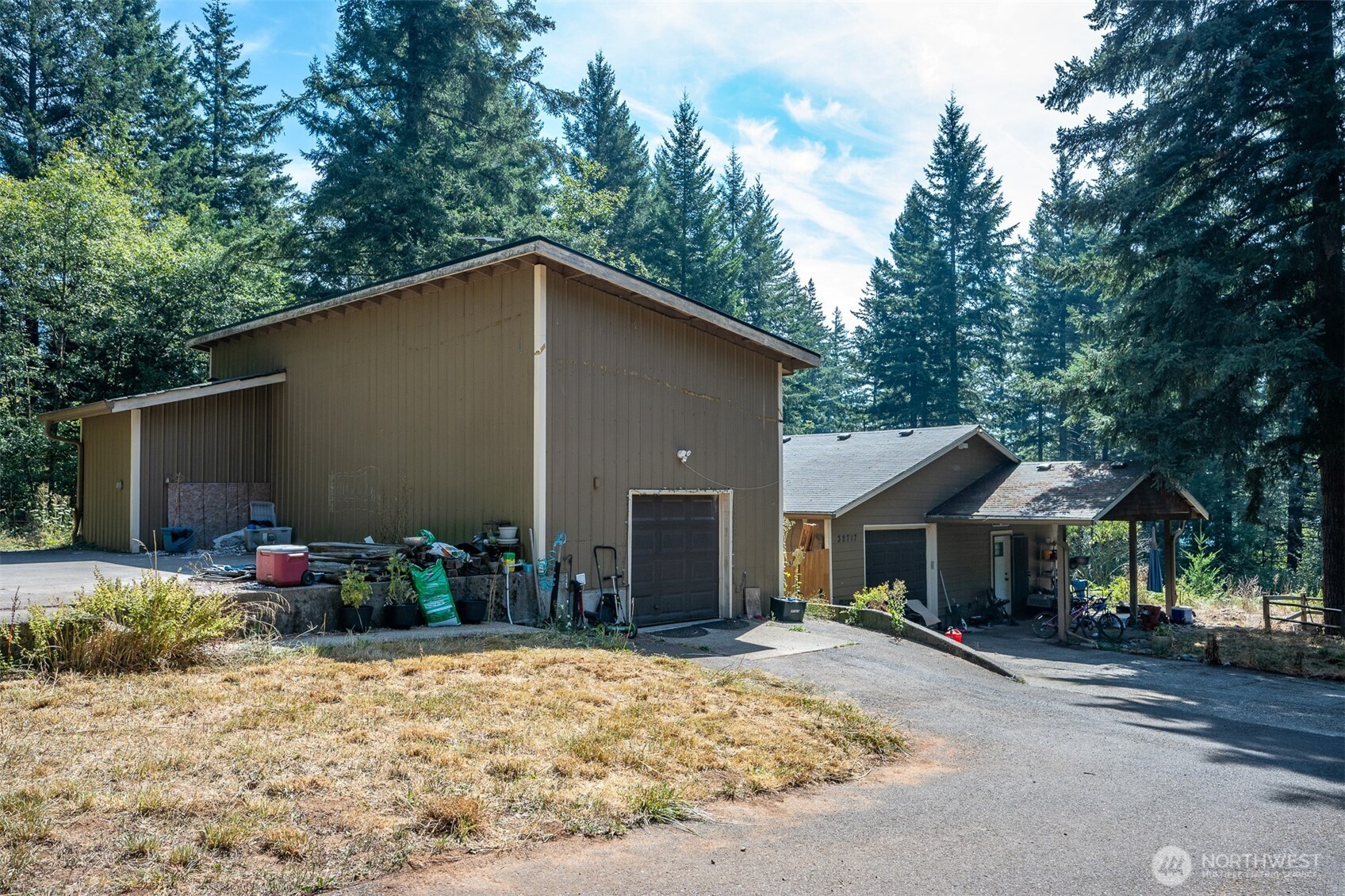 Nestled on a private 3 acres in the highly desirable Camas school district, this turnkey property offers the rare combination of space, privacy, and stunning Mount Hood views.    The 1,348 sqft main home features three bedrooms and two bathrooms, while the detached 1,000 sqft permitted ADU adds another full kitchen, a bedroom, and another full bath. This extra space is perfectly suited for multigenerational living, an in-law suite, or a home office.    Enjoy the peace of a private small acreage setting with all appliances included, so you can move in and simply relax, breathe, and play.