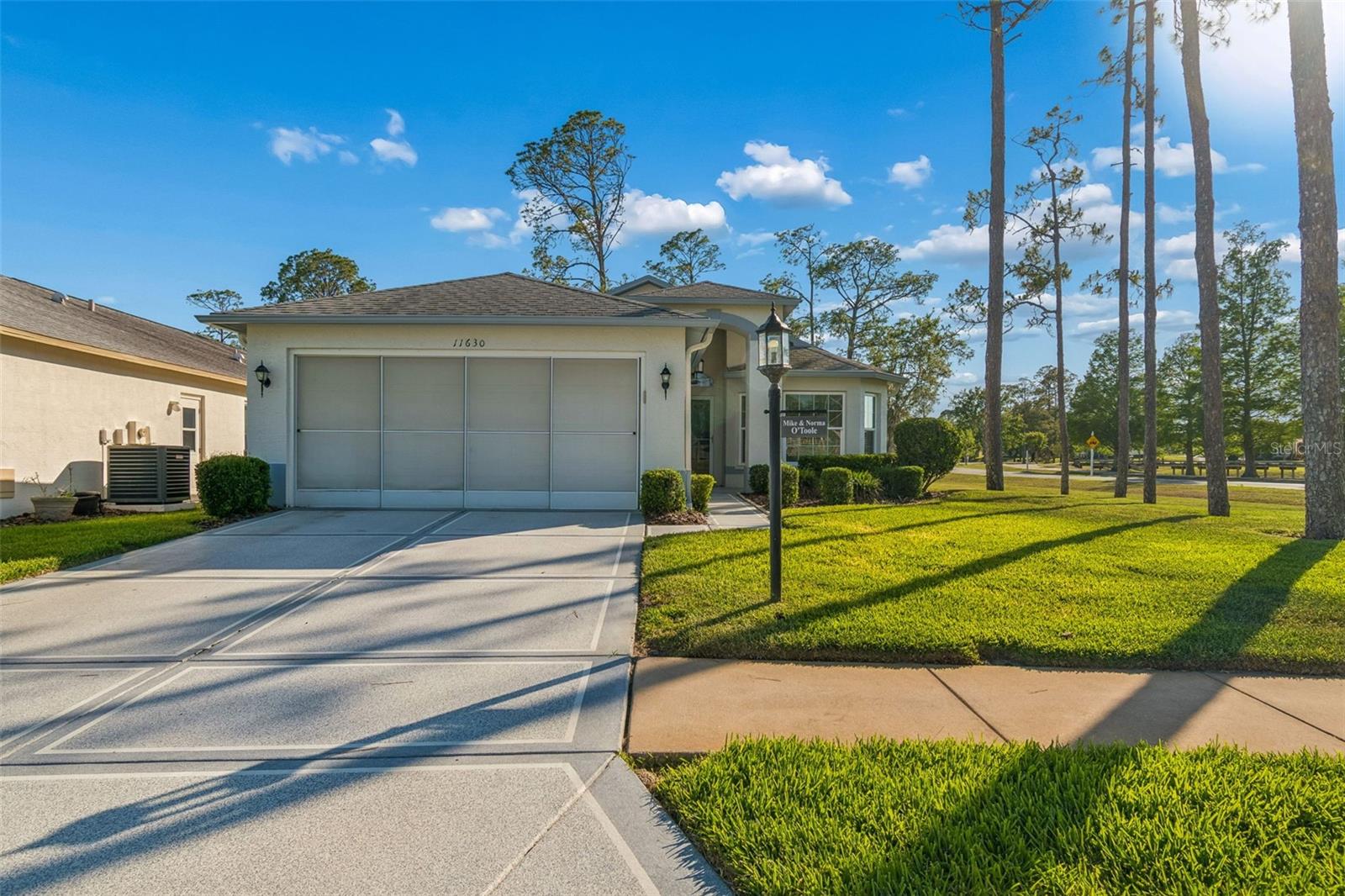 Move in Ready (Turn Key) Modified St. Andrews Model with Views to Golf Course (Hole 10 & Club House) from the Enclosed Lanai and Patio.  This is a 3 Bedroom, 2 Bath with Great Room and Breakfast Nook (Bay Window).  Kitchen has Recessed Lighting, Dishwasher, Microwave, Range, Refrigerator and Closet Pantry.  Master Suite has two Walk-in Closets, Extra Large Tub and Walk-in Shower, Dual Sinks.  Attached Garage has Storage Cabinets and Screens.  Double Pane Huricane Windows Throughout Including Lanai.  Located in a "Maintained" Village which also includes Exterior Painting every 7 Years...so no Outside Yard Work for you!  A/C 2018, Hot Water Tank - 2020, New Windows 2013, Gutters.  This home comes Furnished with a 4 passenger EZ Go Golf Cart!! Heritage Pines is the Premier Gated 55+ Golf Course Community Offering Amenities and Activities for All Interests--Heated Pool and Jaczzi, Tennis Courts, Pickle Ball Courts, Bocce Ball, Full Service Restaurant and Lounge, Fitness Center, Performing Arts, Billiards, Craft Room, and the list goes on.  Convenient to Tampa, Beaches, Fishing, Boating, Shopping, Dinning, Entertainment and the Airport.  Enjoy living in a Secure Gated Community - Florida Living at its Finest!