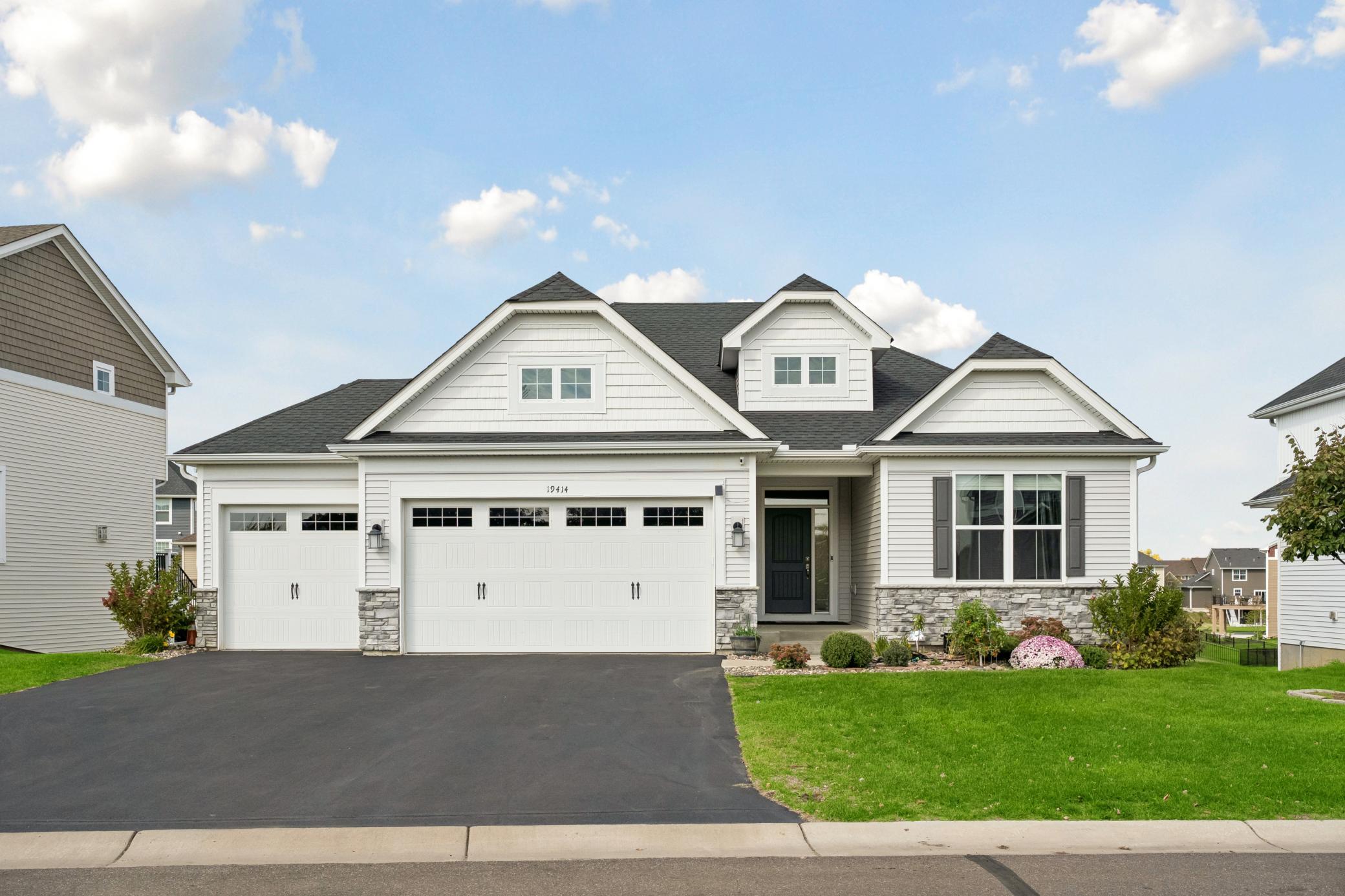 Welcome to this exceptional one-story home located in the highly sought-after Ravinia neighborhood of Corcoran. Meticulously maintained and thoughtfully designed, this spacious residence offers an open and light-filled layout with high-end finishes and attention to detail throughout. Featuring four bedrooms, three bathrooms, and a three-car garage, this home seamlessly blends style and functionality. The main level is ideal for both entertaining and everyday living, showcasing a welcoming front porch, an open foyer, a private office/bedroom, a large mudroom, and an informal dining area. Moving further into the main level, you'll find three generously sized bedrooms and two bathrooms. This includes a luxurious primary suite with a large walk-in closet and a spa-like bath featuring an expansive walk-in shower and dual vanities. A full laundry room on the main level adds ultimate convenience. At the heart of the home, the gourmet kitchen impresses with custom cabinetry, stainless steel appliances-including a gas cooktop, wall oven, and microwave-quartz countertops, a walk-in pantry, and a large center island. The spacious dining area flows effortlessly into a sun-drenched living room complete with a beautiful floor-to-ceiling stone fireplace. Just off the dining area, enjoy seamless outdoor living on the maintenance-free 25x1 4 deck that overlooks the backyard. The expansive walkout lower level offers a large family room, amusement room, a fourth bedroom, a full bathroom, a storage room, and a large utility room. Step outside to the private, oversized stamped concrete patio16x35, perfect for relaxing or entertaining. Residents of Ravinia enjoy access to wonderful community amenities, including a neighborhood pool, clubhouse, and playground. Situated in the award-winning Wayzata School District and conveniently close to parks, lakes, trails, shopping, and dining, this home offers an unmatched lifestyle in a truly desirable location. Welcome home.