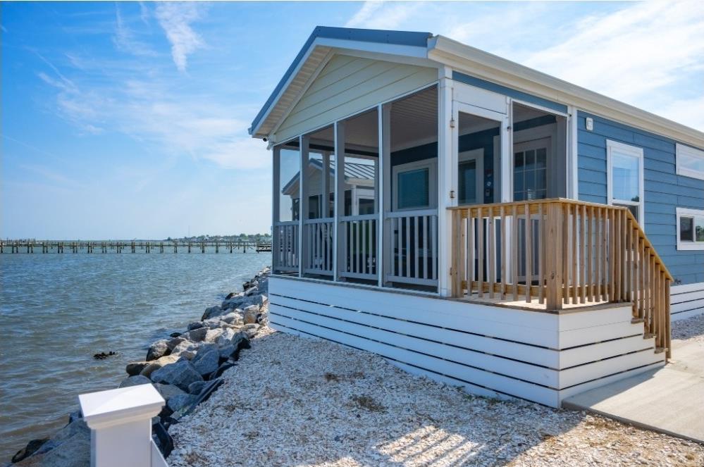 Welcome to BluFin Cottages, a rare opportunity to own a charming coastal getaway on beautiful Chincoteague Island! These thoughtfully designed individual cottages blend modern comfort with classic Island style. Whether you're seeking a personal vacation home or an investment property with strong rental potential, the cottages at BluFin offers the best of both. Cottage is situated on leased waterfront and a land lease is required.