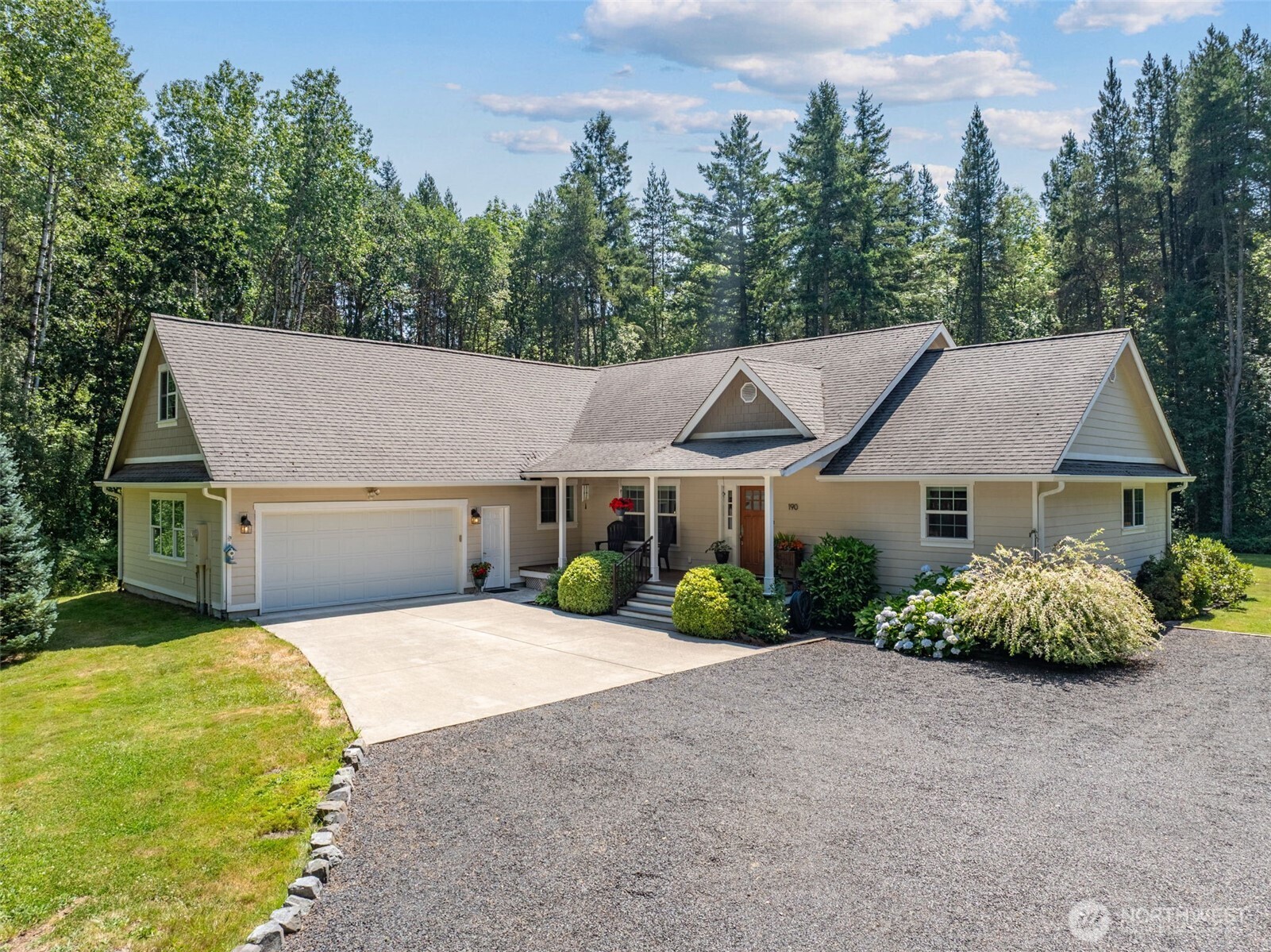 Escape to your own private retreat on 4.8 beautiful acres in a peaceful country setting! This well-cared-for, custom home offers a warm and inviting interior with an open, functional layout and abundant natural light. The spacious kitchen features expansive cabinetry, granite countertops, a large center island and plenty of workspace. Enjoy cozy evenings by the freestanding wood stove or step outside to relax and take in the serene, wooded surroundings. Beautiful grounds offer expansive lawn space, mature trees and a picturesque setting with room to enjoy the outdoors. A large garage provides excellent space for projects, hobbies and storage. Generous laundry and utility areas add everyday convenience. Tucked away in a quiet setting yet offering all the comforts of home, this special property delivers the space, privacy and peaceful country lifestyle you've been looking for!