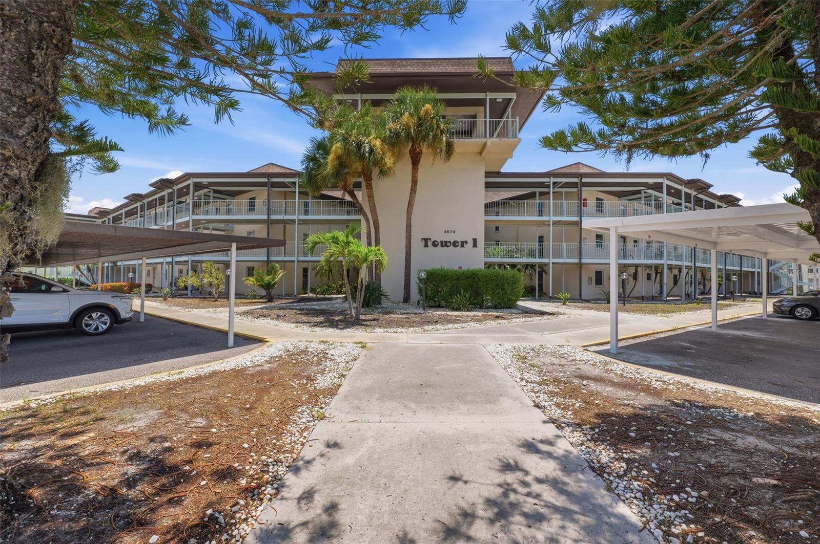 Welcome to this beautiful 2-bedroom, 2-bathroom first-floor condo in Gulf Harbors, offering tranquil water views and a relaxed coastal lifestyle.Luxury vinyl plank flooring flows throughout the home, creating a seamless and modern look, while large sliding glass doors fill the living space with natural light and provide beautiful views of the water. The interior has been freshly painted, and brand-new appliances add an updated touch to the kitchen.The monthly HOA fee includes building and flood insurance, internet, cable, water, sewer, exterior and grounds maintenance, roof, on-site management, access to community pools and clubhouse, and assigned covered parking. Enjoy peaceful waterfront views right from your living room. Residents also have the option to enjoy the private Gulf Harbors Beach Club, located just 3 miles away, for an additional $225.If you’re looking for low-maintenance Florida living with beautiful water views and fantastic amenities, this condo is a must-see!
