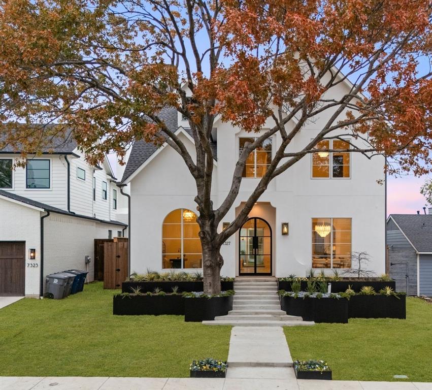 Stunning California Modern home located in the heart of Lakewood, just steps from White Rock Lake and premier hiking-biking trails. This luxury residence features 4 bedrooms, 4 full bathrooms, and 2 half bathrooms with a sophisticated stucco exterior and warm modern design elements throughout. The open-concept floor plan showcases wide-plank white oak floors, custom cabinetry, and high-end appliances. The spacious downstairs master suite offers a serene retreat with spa-inspired finishes and generous closet space.A gourmet kitchen opens to the main living and dining areas, creating an ideal setting for daily living and entertaining. Home is fully wired for a security system and AV integration. Large windows bring in abundant natural light and frame views of the backyard oasis featuring a sleek pool and expansive covered back porch.Located within walking distance to White Rock Lake, trails, parks, and zoned to highly sought-after Lakewood Elementary.