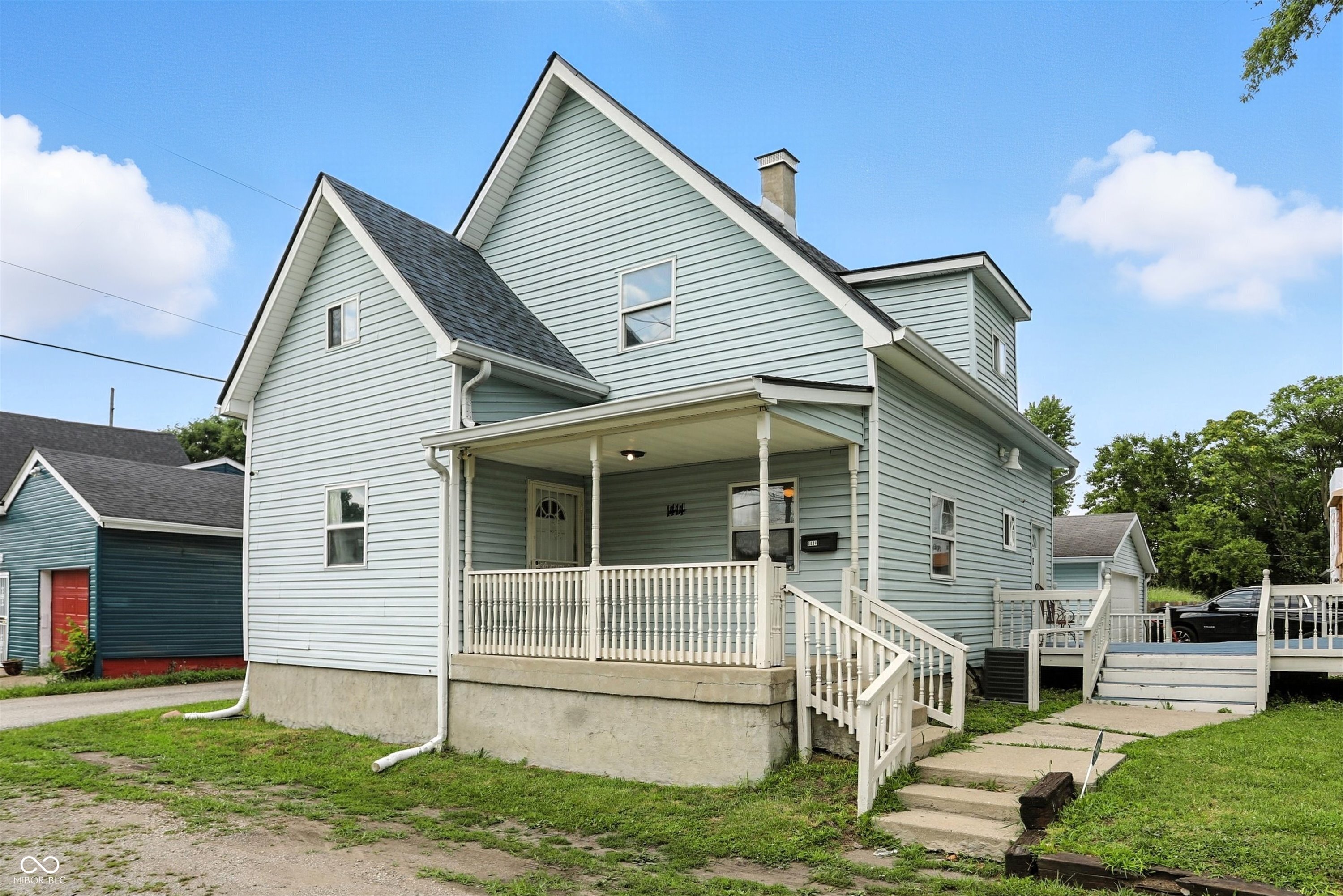 Spacious 3 bed, 2 full bath home on two lots with updates and investment potential! The large eat in kitchen opens to the family room making it great for entertaining. A main floor bed and full bath offer flexible living options-perfect for guests or a convenient home office setup. The home features a large detached 2-car garage with garage doors on both sides, offering great functionality perfect for workshop access, storage, or added convenience. Enjoy a generous outdoor living space with a two-tiered deck and mature trees for added privacy. Recent upgrades include new roof, new flooring, painted kitchen cabinets, fresh paint throughout and tiled basement floor. The home has a great layout with room to grow! Whether you're looking for your next home or a smart investment opportunity, this property has great potential.
