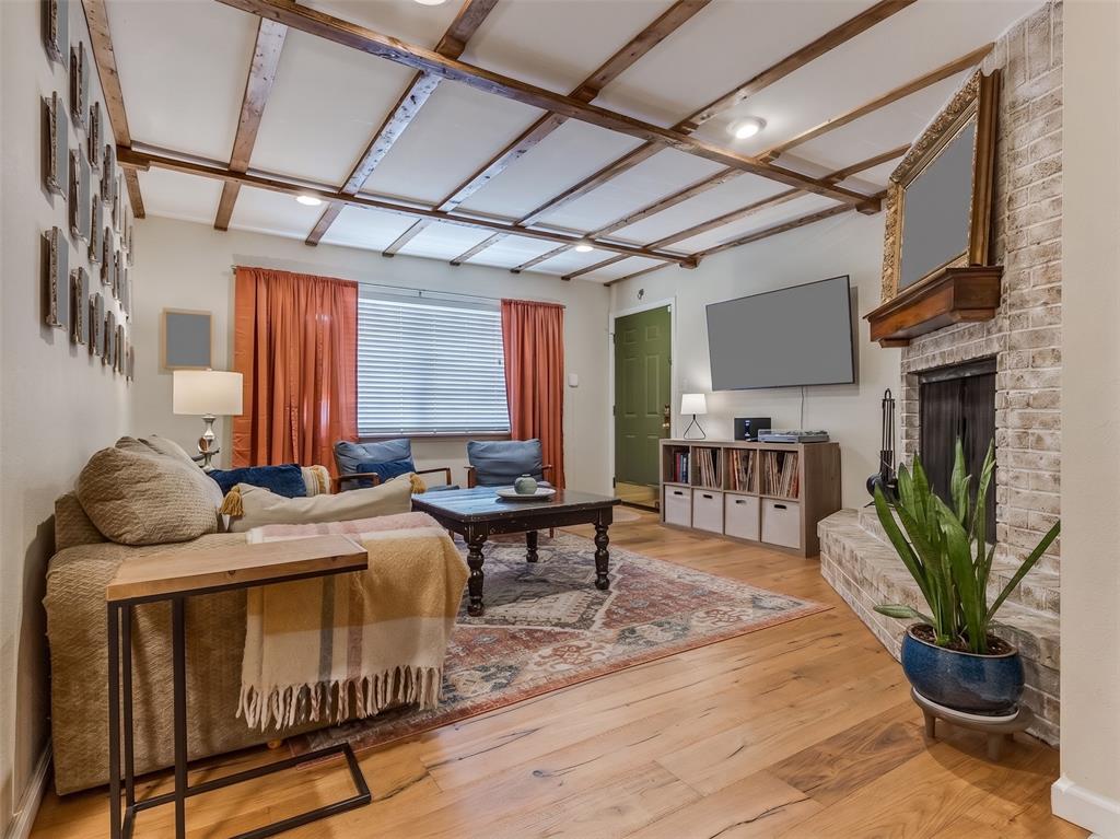 Welcome to this beautifully updated, owner-occupied condo, offering a comfortable blend of modern finishes and timeless character. The inviting living room features wide-plank oak hardwood flooring, striking wood ceiling beams, and a cozy wood-burning fireplace—creating a warm and welcoming space to relax or entertain. Hardwood flooring continues through the hallway, while the kitchen and bathrooms feature durable, grouted porcelain tile.The updated kitchen offers quartz countertops, soft-close cabinet doors, and a new dishwasher installed in 2025. The bathrooms are finished with granite countertops, and ceiling fans are conveniently located in the dining area and bedrooms for added comfort.Enjoy the convenience of in unit washer and dryer which are remaining in the home. Recent HOA improvements add even more peace of mind, with the roof and siding replaced in 2025. The HOA fee covers landscaping and snow removal, parking lot maintenance, basketball courts, pool access, maintenance of common grounds, exterior insurance, water, sewer, and garbage service.This pet-friendly community allows up to two pets per unit, and this condo is allotted two parking spaces. With its thoughtful updates, attractive finishes, community amenities, and recent exterior improvements, this condo is move-in ready and offers easy, low-maintenance living.Condo is being sold in "as-is" condition