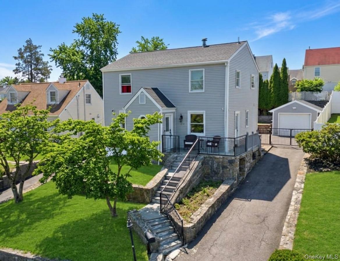 Welcome to 115 Young Avenue, a charming 4-bedroom, 2-bath Colonial that blends timeless character with everyday comfort in a convenient Yonkers location. Inside, you'll find inviting living spaces, including a warm and welcoming living room with fireplace, stainless steel appliances, a dedicated laundry room, and a layout that offers flexibility for both daily living and entertaining.Outside, a detached one-car garage and long driveway provide ample parking, while the property's location places you close to many of Westchester's most popular destinations. Enjoy easy access to Central Park Avenue shopping and dining, Cross County Shopping Center, Ridge Hill, Untermyer Gardens Conservancy, Tibbetts Brook Park, and the vibrant Yonkers Waterfront. Nearby recreational opportunities, restaurants, cafes, and local conveniences make it easy to enjoy everything the area has to offer.Commuters will appreciate convenient access to the Saw Mill River Parkway, Bronx River Parkway, Cross County Parkway, and I-87 (New York State Thruway), as well as Metro-North service from the Yonkers, Glenwood, Tuckahoe, and Bronxville stations, offering straightforward access to Grand Central Terminal and destinations throughout Westchester and New York City.Located within the Yonkers Public School District, this home offers a wonderful opportunity to enjoy classic Colonial charm, comfortable living spaces, and a location that combines neighborhood convenience with easy access to shopping, recreation, and transportation.