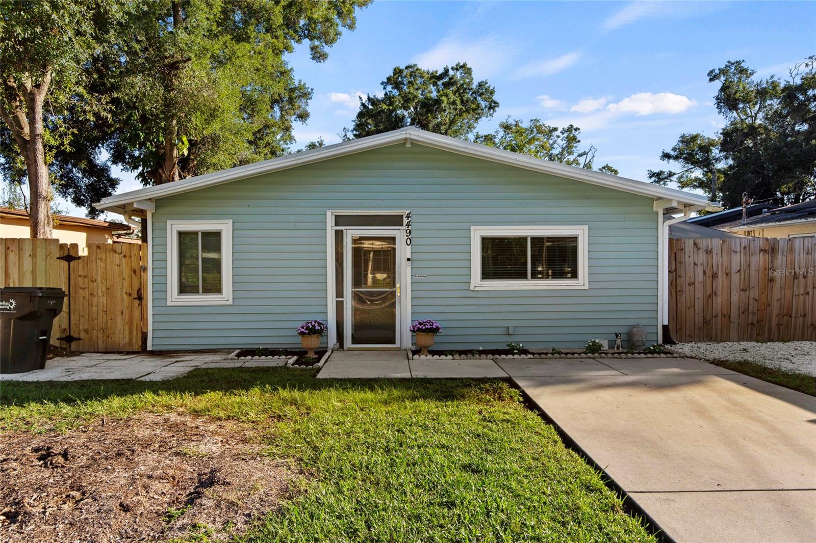 Welcome home to this beautifully updated 2-bedroom, 1-bath property tucked away on a quiet dead-end street and backing directly to Raymond H. Neri Park. Offering a unique combination of modern updates, flexible outdoor space, and a peaceful setting, this home is move-in ready and full of possibilities.The home was thoughtfully updated in 2019 with hardwood soft-close cabinetry, stainless steel appliances, central A/C, a Nest smart thermostat, Schlage keyless entry, fresh interior and exterior paint, new windows, a new driveway, and recessed LED lighting.2026 updates include a new hot water heater, full hot-and-cold-water re-pipe, smart-home lighting, custom French doors, waterproof luxury vinyl plank flooring, and a custom double gate accommodating up to an 18-foot boat or RV along the side of the home.Additional features include a metal roof, indoor laundry room with washer and dryer, approximately 400-square-foot sunroom, fenced backyard, storage shed, paver side-yard patio with space for grilling and relaxing, and a designated fire-pit area. The open kitchen and living area create a welcoming space for everyday living and entertaining.One of the property’s standout features is its location directly behind Raymond H. Neri Park, a newly rebuilt 38-acre recreational and natural area reopened in 2026. The park offers fitness equipment, two dog parks, multiple playgrounds, and a mile-long paved multi-use trail winding through the property and across two bridges overlooking Joe’s Creek. The surrounding natural habitat is home to a variety of Florida wildlife, including birds, turtles, alligators, and otters.The property is also located just 3 minutes from Lealman Exchange, a community resource center offering programs and events for all ages, including movie nights, morning markets, and more. The space is also home to the Lealman YMCA preschool Academy hosting youth from infancy to VPK.Located in unincorporated Pinellas County, this property may offer additional flexibility for owners interested in rental opportunities, subject to applicable county and local regulations. It also presents an excellent opportunity for a first-time homebuyer, with potential access to Pinellas County down payment assistance programs for qualified buyers.Enjoy the best of a peaceful residential setting while remaining just minutes from St. Pete’s beaches, downtown, dining, shopping, and entertainment.Priced at $249,999 — schedule your private tour today!