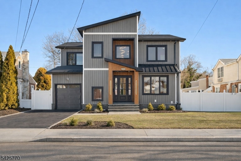 Modern elegance with architectural detail-5BR, 5BA new construction on a new and existing foundation, showcasing exceptional craftsmanship and offering 3,500+ sq ft of finished space, this home delivers elevated living in a prime Fair Lawn neighborhood. The open layout features a first-floor bedroom and full bath, mudroom, and expansive living and entertaining spaces with French doors leading to a partially covered deck for seamless indoor/outdoor flow. The statement kitchen offers quartz island, countertops and stainless steel appliances. The serene primary suite includes dual walk-in closets and a spa-inspired bath. Three additional bedrooms, two full baths, and a laundry room complete the upper level. Finished basement with full bath provides flexible space for a gym, media room, or home office. Conveniently located near top schools, NYC trains and buses, parks, dining, shopping, and houses of worship, this home perfectly blends luxury and lifestyle.