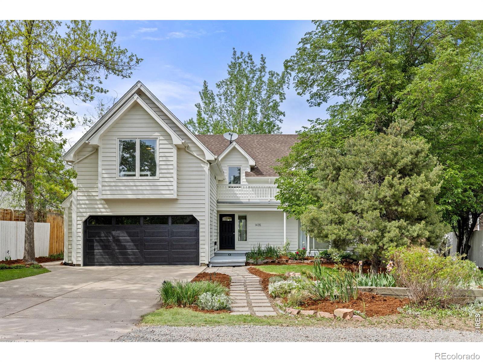 Tucked into a peaceful, rural-feeling North Boulder setting, this light-filled 5-bedroom home blends comfort, function, and an unbeatable location. Just steps from the Wonderland Lake Trailhead, and moments to Lucky's Market, local dining, Uptown Broadway, and highly regarded Crestview Elementary, the setting offers both convenience and a true neighborhood feel.A welcoming front porch sets the tone, and inside, expansive windows fill the home with natural light while framing the surrounding greenery. The main level features warm hardwood floors, a cozy wood-burning fireplace, and an easy, open flow that connects indoor and outdoor living. Step outside to enjoy not one, but multiple outdoor spaces-including a large new custom composite deck in the backyard, perfect for entertaining or relaxing in the private, maturely landscaped yard.The kitchen is bright and functional with an efficient layout and walls of windows that overlook the serene outdoor setting. Upstairs, all five bedrooms are thoughtfully situated, including a spacious primary suite with its own private deck and beautiful mountain views-an ideal retreat to start and end your day. Four additional bedrooms and two bathrooms are set in a separate wing, offering flexibility and privacy for family or guests.With fresh interior and exterior paint, thoughtful updates throughout, and a location surrounded by rising values and newly built luxury homes, this property offers a compelling opportunity in one of North Boulder's most desirable neighborhoods.