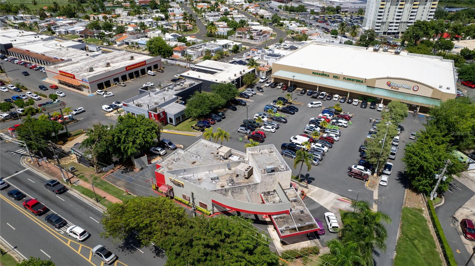 For Sale: Dorado del Mar Shopping Center – Fully Leased, Prime Investment Opportunity in Dorado, Puerto Rico
Dorado del Mar Shopping Center presents a rare investment opportunity in the heart of Dorado, Puerto Rico. Offering 137,944 square feet, this thriving retail center comprises three inline buildings, six free-standing units, and an anchor space occupied by SuperMax.
100% leased to 33 tenants, the center boasts a strong and diverse mix of national and local retailers, ensuring a stable and reliable income stream. Notable tenants include SuperMax (40,601 SF), Advance Auto, KFC, Enterprise, Baskin Robbins, Burger King, Sally’s, Taco Bell, Pizza Hut, The Winery Outlet, The Yellow Door, Me Salve, Rainbow, Pep Boys, Subway, Johnny’s Pool, Petxotic, Always 99, Firehouse Subs, and many more. Strategically positioned in a highly desirable retail trade area, Dorado del Mar Shopping Center benefits from an affluent customer base, strong tourism demand, and high visibility. With consistent returns and growth potential as leases renew, this property stands out as a premier commercial investment. NDA required by the principal prior to receiving financial information. Don’t miss this exceptional opportunity to invest in a bustling, high-demand location in the heart of Dorado.