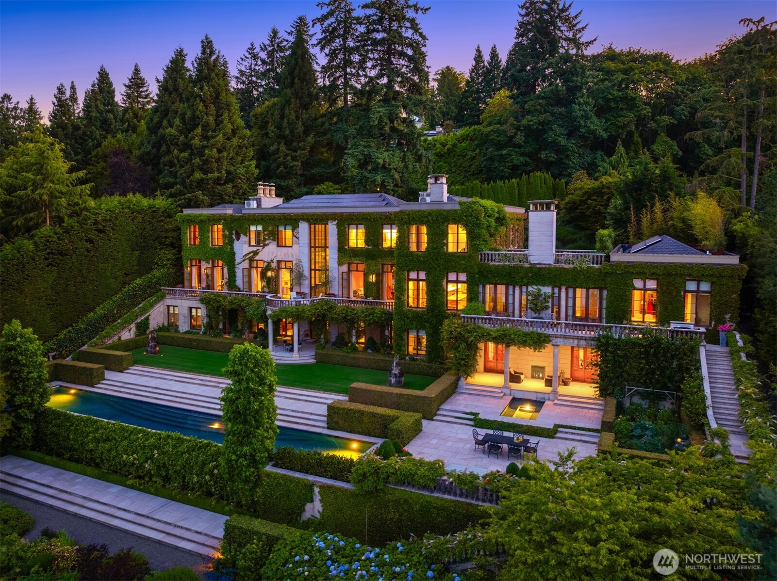 Characterized by timeless European elegance, this exceptional residence reflects refined Georgian sensibility with a deep respect for scale, proportion, and rich, enduring materials, yet functions flawlessly with regard to livability and daily enjoyment. Situated on the shores of Lake Washington, the lake, mountain & skyline panorama beckons from every room, terrace and garden. Tall symmetrical windows, 12 fireplaces, superb craftsmanship, gracious rooms with excellent flow, and inviting spaces. Seamless indoor-outdoor living offers a rare 160 ft natural pebble beach, boat dock, enchanting lakeside garden pavilion, swimming pool, spa, and entertainment terraces. Sustainable Geothermal and Photovoltaic systems. PLS SEE PHENOMENAL VIDEO