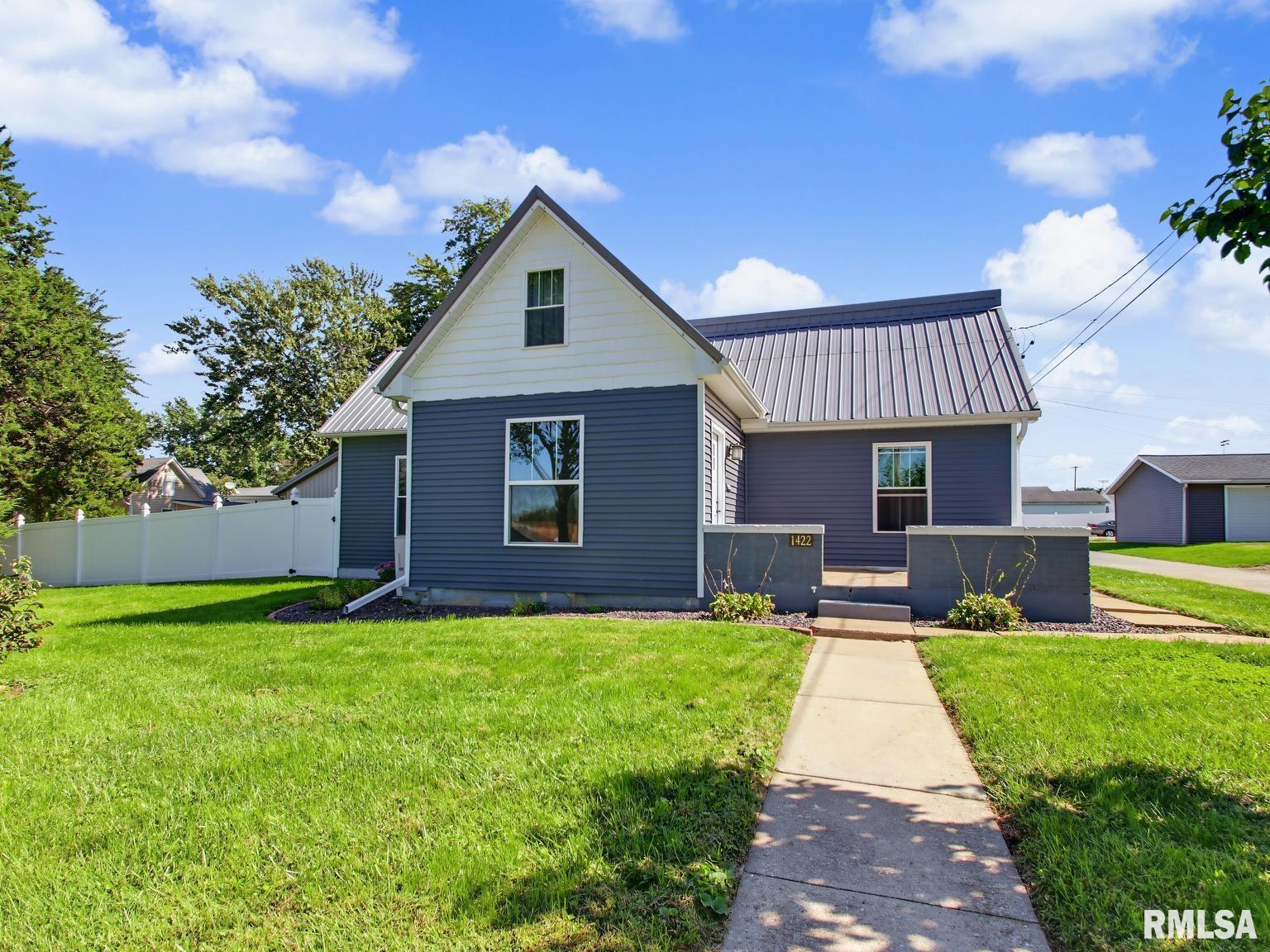 Stunningly Rebuilt & Modernized 1.5 Story Home with Massive Workshop/Garage. Experience the perfect blend of timeless charm and modern peace of mind with this thoughtfully rebuilt and updated home. Renovated in 2017 boasts modern upgrades including a metal roof, vinyl siding, replacement windows, updated electrical, plumbing, HVAC, and water heater. Inside you will find beautifully refinished hardwood floors that stand out and preserve the homes original character. The standout feature is the spacious second floor primary suite addition, which includes a private door leading to an upper porch suited to support a future outdoor patio area. The massive 28x40 open outbuilding equipped with water hookups and natural gas creates a perfect opportunity for storage, business, or hobbyists to have room to work and play. The property also has a detached 2 car garage with workshop area for additional parking. Don't miss out on your chance to view this wonderful 3-bedroom 3- bath home.  Give us a call today .