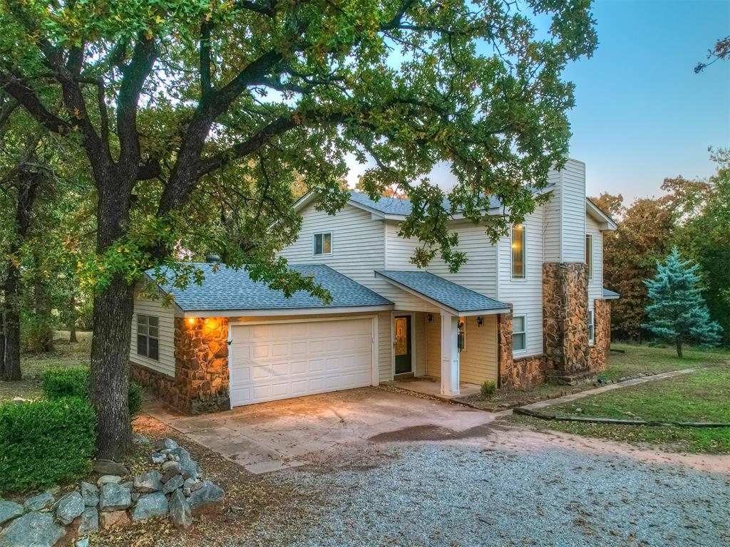 Welcome to your very own storybook home. From the wooded lot to the stacked stone that greets everyone who pulls into the circle drive, to the magical sunsets, this property has the quiet of being in the country while still being close to a major highway and about a 10-minute drive to major grocery stores, a movie theater, and plenty of dining options. Situated on nearly 2 acres, this home features a beautiful rock fireplace, a loft with an attached bathroom, and a second living/dining room with a wall of windows that floods the space with natural light. The shop/garage out back has so much potential. Need extra living quarters? Build it out. Need extra workspace? You got it. Don't miss this incredible opportunity to call this space - HOME.