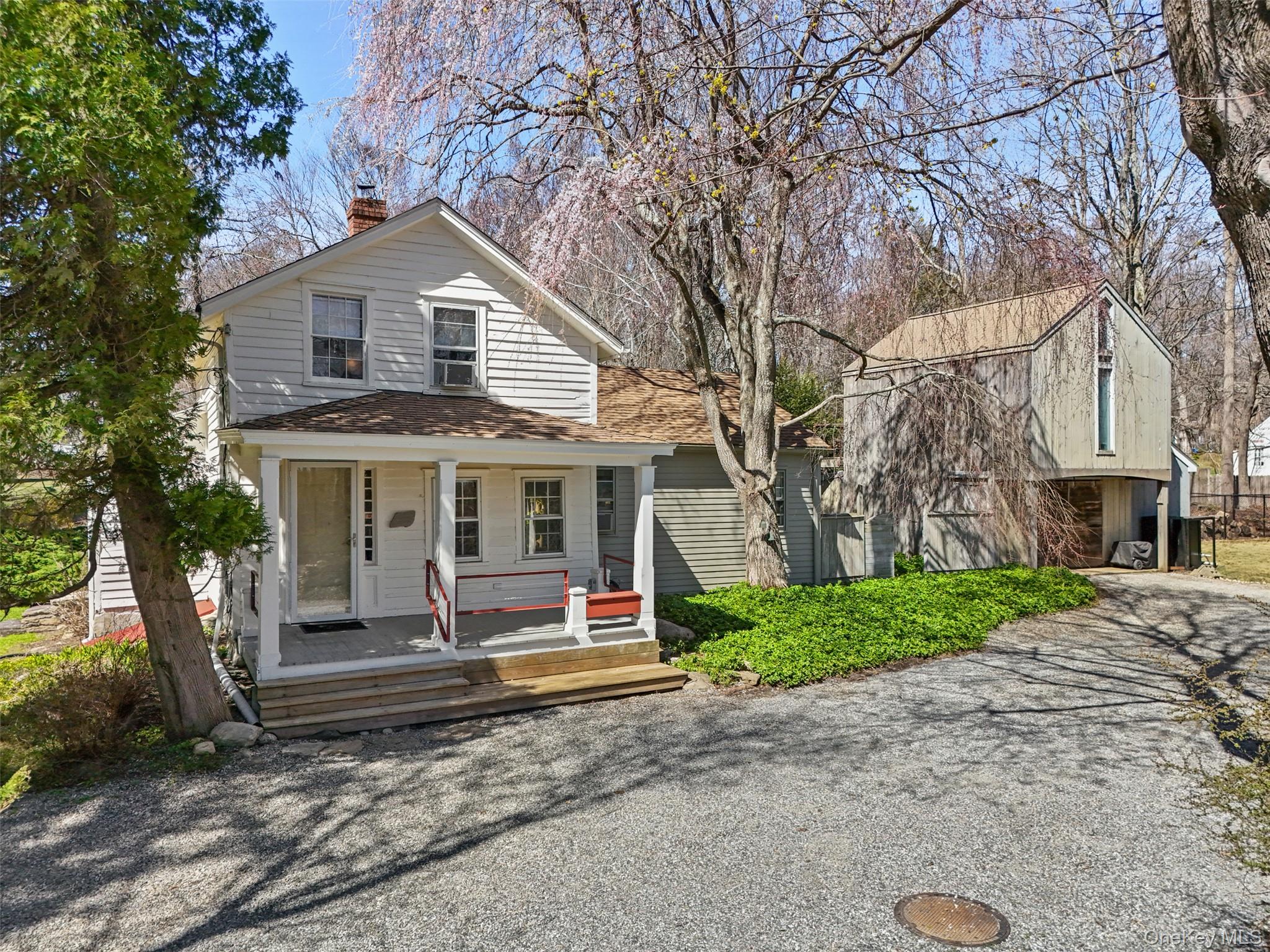 STEP INTO THE PAST. Part of South Salem’s rich history. Charming Antique Farmhouse, circa 1775, once a general store and post office. Rocking Chair Porch. Original Front Parlor. Country Kitchen. Warm and inviting Living Room with vaulted ceiling and doors to rear deck. Two Bedrooms and Two Baths. Separate Barn with garage bay and second floor 320 sq ft heated Studio with vaulted ceiling.  Picture book one-acre setting with verdant lawns, old stone walls and mature trees. Conveniently situated with easy access to the shops and restaurants of Ridgefield and New Canaan, the Metro-North train and commuting arteries. First time listed in years!