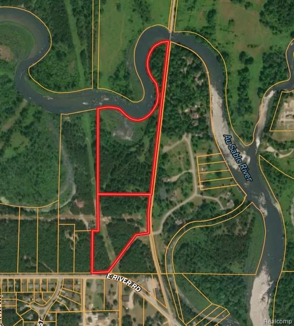 25 acre of wooded River Frontage on the Beautiful AuSable River.  Unbelievable opportunity to own over 1600 feet on the main AuSable River matched with over 25 acres of woods on River Road.  This property has municipal water available at the street for potential development opportunities.  The local municipality has been favorable to development ideas with this parcel recently.  Close to town and all the  amenities of downtown Oscoda.  Bring your thinking cap to develop tis piece or make it an awesome homestead.  There are very few opportunities to own this much wooded frontage on the AuSable River. This sale includes 2 parcels: 063-033-400-004-00 is 10.16 acres & 063-033-400-005-00 is 15.01 acres. Must be escorted by a Licensed Agent to tour this property.  Please DO NOT TRESPASS.