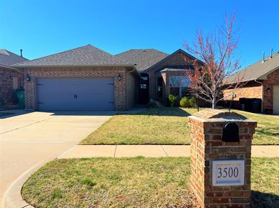 Spacious 3 bedroom, 2 bathroom Storm shelter located in the garage, located in Ironstone Addition within Edmond Schools. Kitchen opens to dining area and living room with a gas fireplace. Granite counter tops throughout, custom cabinets, ceiling fans, low E windows, lawn irrigation system, and a TV cabinet on the patio. Community features a playground, basketball court & walking trails with convenient highway & turnpike access! Covered patio and fully fenced backyard.