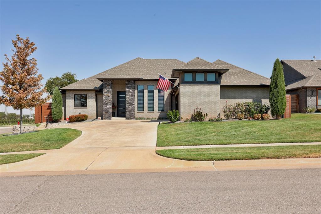 Welcome to this stunning contemporary modern home located in the highly sought-after Deer Creek School District in Edmond, Oklahoma. Perfectly positioned on a premium corner cul-de-sac lot with no neighbors behind, this luxury home offers modern design, high-end finishes, exceptional privacy, and outstanding neighborhood amenities.From the moment you arrive, you’ll be impressed by the wraparound driveway, professional landscaping, clean architectural lines, and incredible curb appeal. Step inside to discover polished concrete floors, soaring ceilings, a dramatic floor-to-ceiling stucco fireplace, and an open-concept floor plan designed for entertaining.The chef’s kitchen is the heart of the home, featuring quartz countertops, custom cabinetry, premium appliances, abundant storage, two pantries, a large center island, and seamless flow into the spacious living area.The oversized primary suite offers a true spa-like retreat with dual vanities, a massive walk-in shower, designer finishes, and two oversized walk-in closets that connect directly to the spacious laundry room.The split floor plan provides privacy, while the generously sized secondary bedrooms and versatile bonus room offer endless possibilities for another bedroom, home office, gym, media room, or playroom.Step outside to your private backyard oasis featuring a covered patio with a motorized sunshade, a fully equipped outdoor kitchen with a built-in grill, and no backyard neighbors. Enjoy relaxing or entertaining year-round in complete privacy.Residents enjoy neighborhood amenities including a community pool and convenient access to shopping, restaurants, and the Kilpatrick Turnpike.If you’re searching for a luxury home in Deer Creek Schools, a modern home in Edmond, or a move-in ready home with an outdoor kitchen and designer finishes, this exceptional property is one you won’t want to miss. Schedule your private showing today.