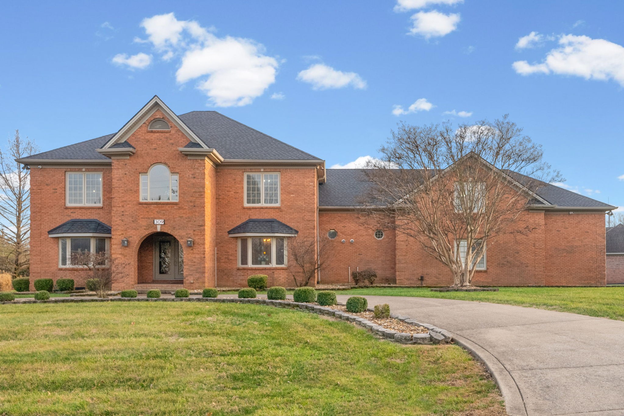 Elegant, expansive, and impeccably maintained, this one-owner custom all-brick residence in Hopkinsville offers over 5,000 sq ft of refined living space, thoughtfully designed for both everyday comfort and upscale entertaining.The home features 5 bedrooms , 5 full baths, and 1 half bath, along with formal living and a formal dining room that create a timeless first impression. Dual staircases add architectural character and functional flow, while an additional private flex space off the living room——provides versatility for a study, library, or retreat.At the heart of the home, the fully updated kitchen showcases quartz countertops, upgraded appliances, an Island and abundant custom storage. The impressive bonus room with wet bar and half bath offers the perfect setting for entertaining on any scale.Quality upgrades and premium features include, New roof (approx. 2 years)Replacement windows (2010),Tankless hot water heaters, Whole-house water softener system, Professional crawlspace waterproofing,Automatic privacy screens on the back porch, Sprinkler system, Extensive storage throughout. Exterior highlights include a circle drive, 3-car garage, and beautifully maintained grounds. From the upper front room, enjoy scenic views with convenient access to Hopkinsville Golf & Country Club, enhancing the home’s lifestyle appeal.Meticulously cared for and move-in ready, this exceptional property also includes furniture that remains with the home, offering a rare turnkey opportunity in one of the area’s most desirable locations.