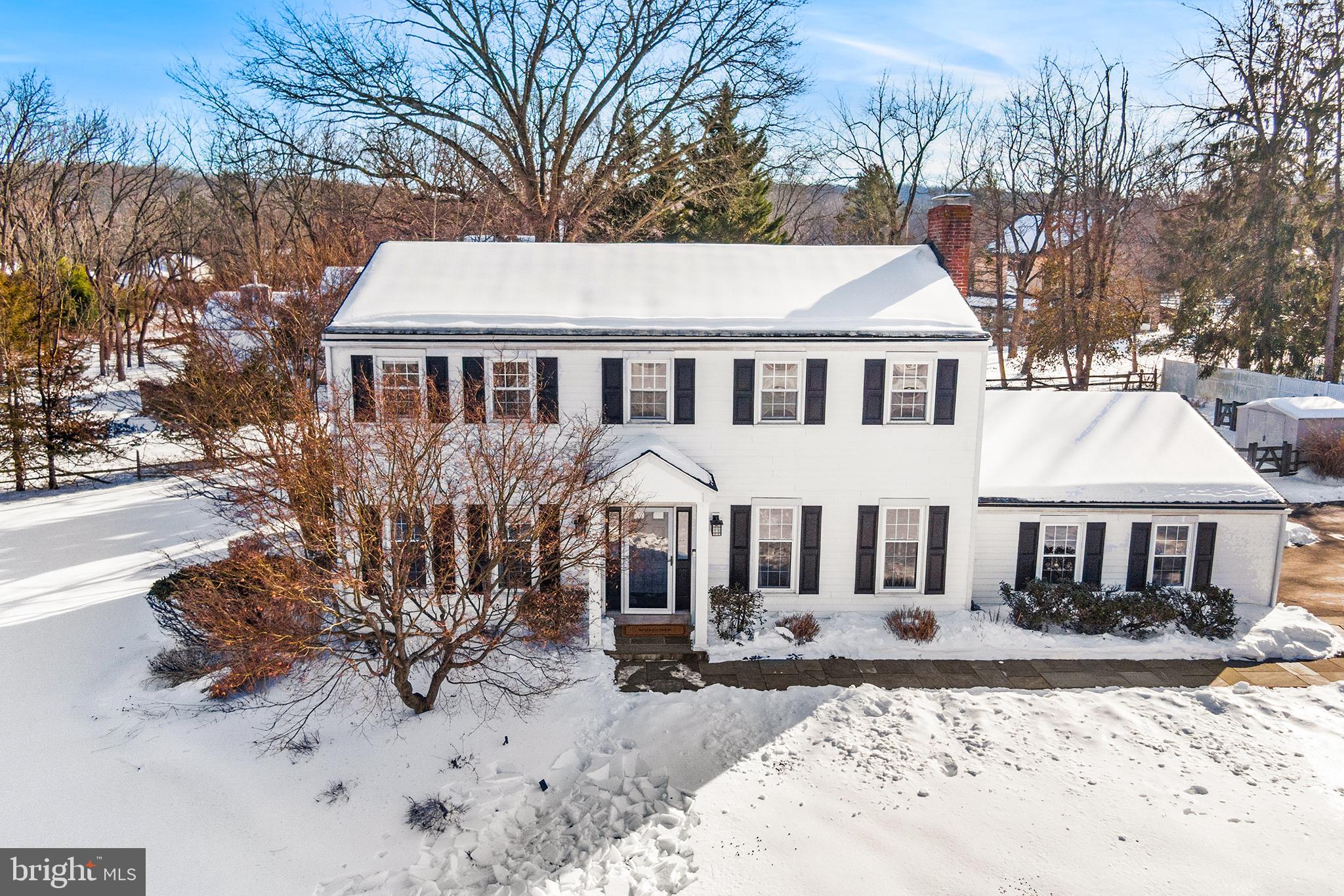 This is it — the Colonial you’ve been waiting for!Set on a large, level lot overlooking a picturesque 5-acre farm with beautiful stone structures, this exceptional home offers timeless charm and scenic views at every turn.From the moment you step onto the flagstone walkway, you’ll appreciate the style and space this home provides. The welcoming foyer features a gracious staircase, coat closet, and powder room. The spacious living room includes a gas fireplace and hearth and opens seamlessly to the updated gourmet kitchen, complete with stainless steel appliances, ample pantry storage, and a double sink overlooking the rear deck and fenced yard.Just beyond, a sun-filled family room — surrounded by windows and sliding glass doors — provides access to the deck and doubles as an expansive dining area, perfect for entertaining. The thoughtful first-floor layout also includes a private office and mudroom off the oversized two-car garage, with abundant storage throughout.Upstairs, a generous landing offers flexible space for a homework area and access to a convenient laundry closet. The primary suite features a large walk-in closet with organizers and an expansive bath with skylight, double vanity, and shower. Three additional bedrooms are well-sized for family or guests, and the hall bath includes a double vanity and tub/shower combination.The full lower level is partially finished, providing additional living and/or entertaining space, plus an unfinished workshop, utility, and storage area. Outside, enjoy the timeless, low-maintenance deck with lighting and stairs leading to the secluded backyard.Simply put, this is an incredible home offering comfort, character, and lifestyle — ready for its next owner to move in and make it their own.
