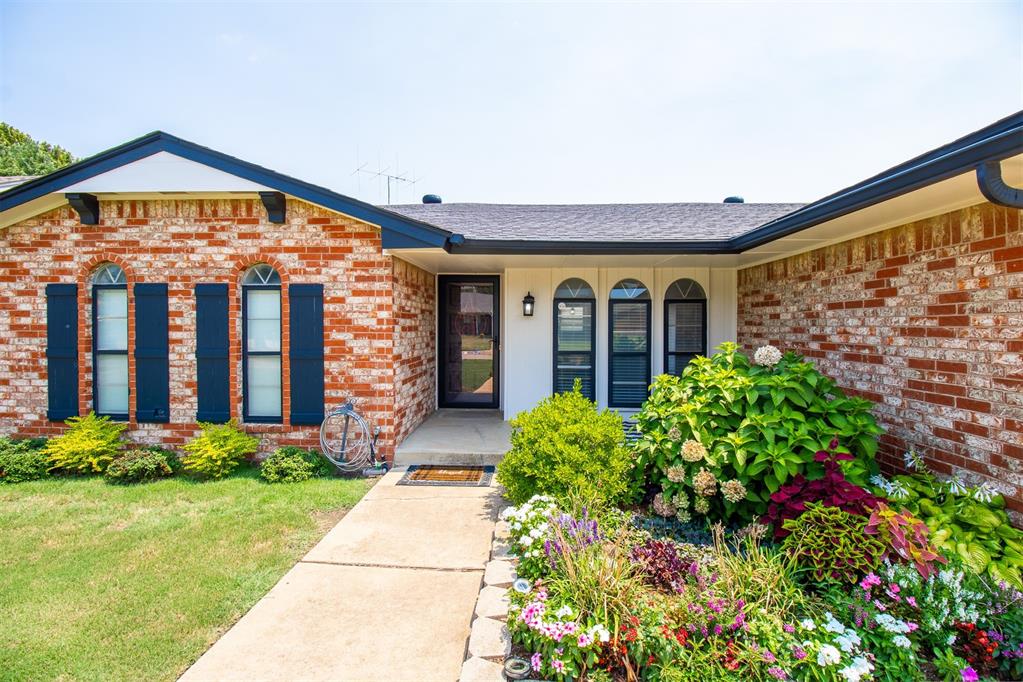 This tastefully updated and lovingly cared for home is ready and waiting for you.  As you enter you are greeted by the lush colorful garden which will brighten your day and spirits. Inside is bright and airy with contemporary colors. A dedicated dining area is tiled and open to the kitchen and living rooms. The updated kitchen with granite counters, long low profile breakfast bar, farm sink, built-in oven & stove is open to the spacious living room complete with a wood burning fireplace flanked by bookshelves. Access from the living to the fenced backyard and patio is convenient and provides tons of natural light. You will be delighted by the contemporary styled remodeled bathrooms. The primary suite is separated from the ensuite by a barn door adding to the contemporary feel of this home.  Additional updates include a new HVAC system in 2020 and hot water heater in 2022 plus the 2 car garage is equipped with a storm shelter.  This home is located minutes from major highways for easy commuting to TAFB, Will Rogers Airport, FAA, downtown Oklahoma City, Bricktown, OU, Norman, hospitals and every possible amenity that Moore has to offer. Schedule your private showing today.