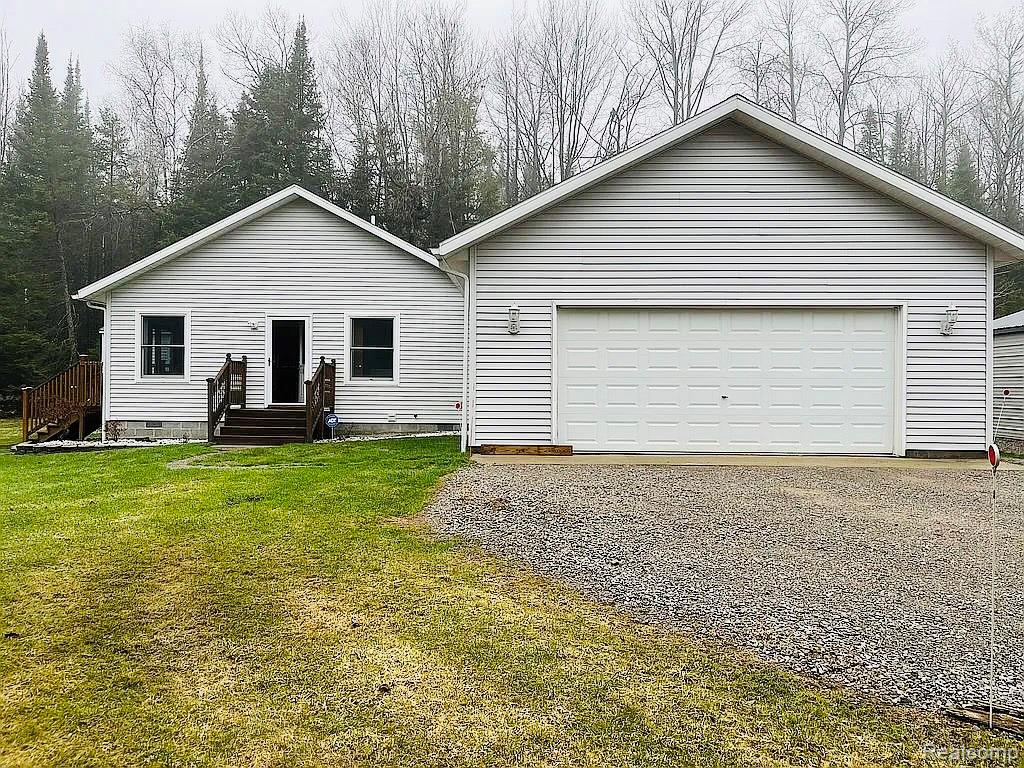 PRIVATE LAKE ACCESS Experience the perfect blend of adventure and tranquility on this beautiful 10-acre wooded property—ideal for hunting, outdoor recreation, and peaceful living. With direct access right from your yard, you can enjoy motorsports, nature walks, and everything Northern Michigan has to offer.This custom-built home (2001) features a spacious layout and a large garage, providing plenty of room for storage and hobbies. The home has a feel with great character and charm throughout.Whether you’re looking for a getaway, a full-time residence, or a recreational retreat, this property truly has it all.