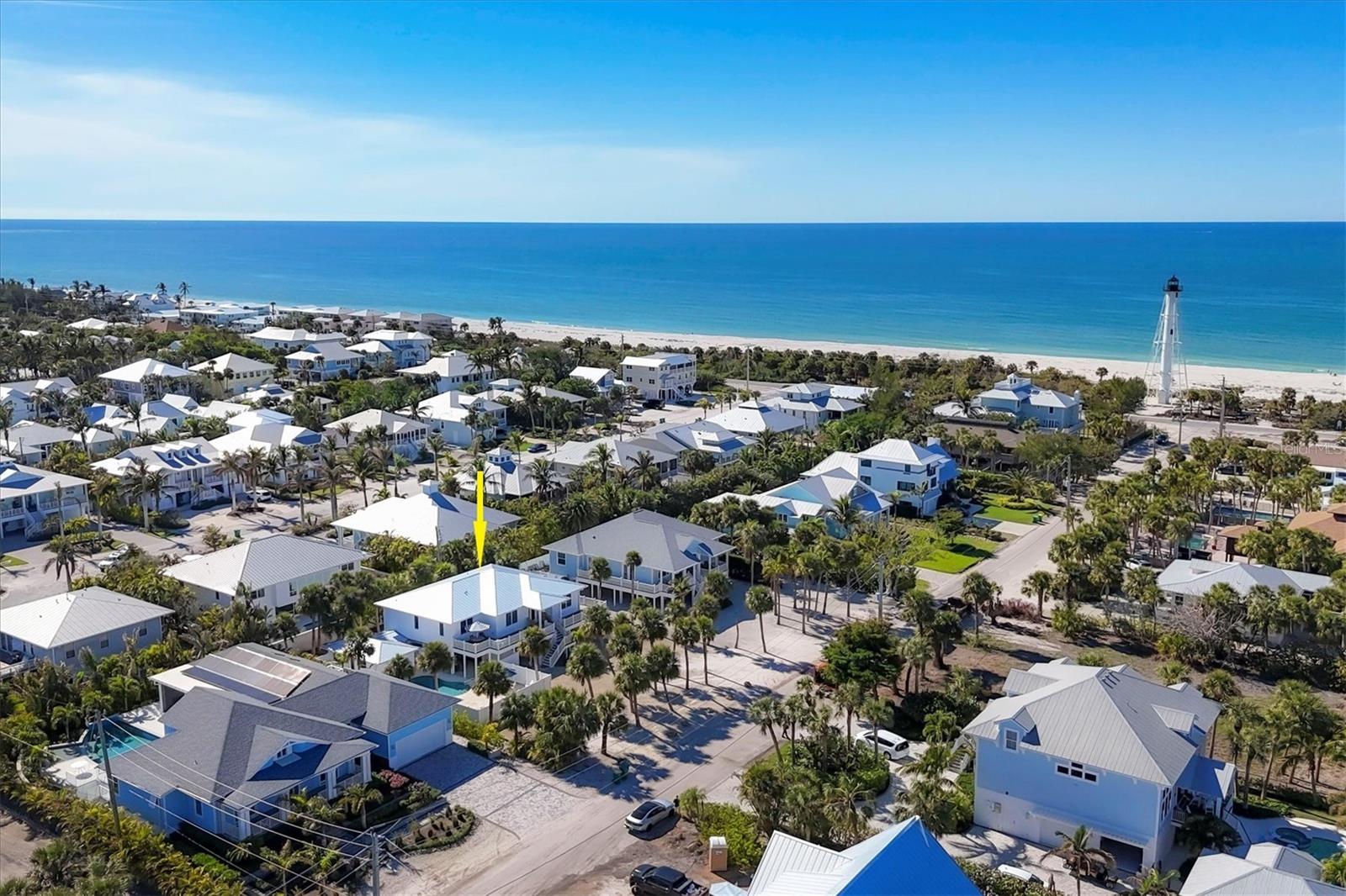 Perfectly located only steps to the beach and a quick bike ride to the village of Boca Grande!  This thoughtfully renovated 3 bedroom, 3 1/2 bath pool home is completely updated inside and out and offered turnkey furnished! The large and inviting front porch has plenty of room for outdoor living with seating to enjoy a meal or the colorful sunsets! Built with hardi plank siding, all impact resistant windows and doors, and a newer (2002) metal roof! Enter and you will find wood floors throughout, a living room detailed with built-ins, and a large dining area. The kitchen features an island with seating for 4, gas stove, quartz countertops, tile backsplash, stainless steel appliances and a wine refrigerator.  To enjoy the outdoors, there is a fenced and heated swimming pool area with an oversized pool deck offering open or covered seating areas. There is also plenty of open parking plus space under the house, as well as an enclosed golf cart garage! For the dog lover, this home is conveniently located near Lee County Park offering fenced dog parks. You can also enjoy the seasonal Boca Grande Famer’s Market, community tennis courts, and just a short walk to watch the spectacular sunsets on the Gulf waters beyond the Boca Grande range light built in 1927!