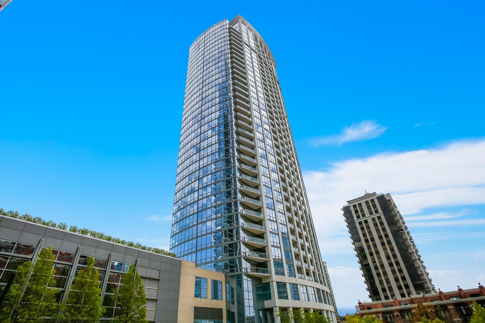 Gorgeous views from every room of this 2Bed/2Bath corner Museum Park condo! Sun-filled unit features floor-to-ceiling windows that showcase stunning city skyline and Lake views, custom window treatments, hardwood floors, stainless steel appliances, granite countertops, new cooktop (2025), custom cabinetry, in-unit laundry, customized closets throughout, and private balcony off of living area to take in the stunning views, perfect for entertaining. Split-bedroom floor plan has spacious primary suite with double closets including a large walk-in closet, a marble bath with double vanity, and a glass shower. Generously-sized guest room has stunning views and den is the ideal home office. Additional storage included & garage parking space available for $35,000 additional. Full amenity building offers 24-hour door staff, outdoor pool, fitness center, party room with sun deck, on-site management, and Amazon Hub along with receiving room. Ideal South Loop location right by many museums, Parks, Northerly Island, Lake Michigan, public transportation, the Loop, and amazing restaurants/nightlife.