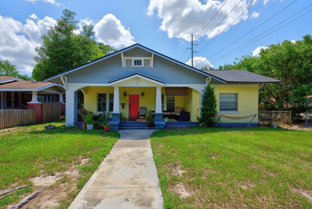 Historic bungalow charm meets modern versatility in the heart of Hampton Terrace. Situated on a desirable corner lot, this distinctive property offers a total of 5 bedrooms, 3 bathrooms, 2,305 square feet, and a detached two-car garage, with a separate accessory dwelling unit that creates exceptional flexibility for rental income, extended family, guests, or a private home office. The main residence features 3 bedrooms and 2 bathrooms with durable vinyl flooring throughout. The updated kitchen is equipped with stainless steel appliances, granite countertops, refreshed cabinetry, and a stylish backsplash. Updated bathroom vanities add to the home’s clean, move-in-ready appeal. The front residence is currently occupied under an annual lease, providing immediate income potential for an investor. The detached ADU includes 2 bedrooms and 1 bathroom, along with its own full kitchen featuring stainless steel appliances, granite countertops, and vinyl flooring throughout. With a private and functional layout, the additional living space offers numerous possibilities while maintaining separation from the primary home. Major improvements include a 2021 roof, a 2017 air-conditioning system for the main residence, and a 2021 air-conditioning system for the ADU. With no HOA, no CDD fees, and no flood insurance required, the property offers added value and fewer ongoing ownership expenses. The location is equally impressive. Walk to Publix, neighborhood restaurants, brewpubs, coffee shops, and many of Seminole Heights’ favorite local destinations. Downtown Tampa, Water Street, Historic Ybor City, and Armature Works are all approximately 10 minutes away, with convenient access to major highways. Whether you are searching for a historic Tampa residence with additional space, a multigenerational living arrangement, or a strong income-producing opportunity, this Hampton Terrace bungalow offers character, flexibility, and an outstanding central location.