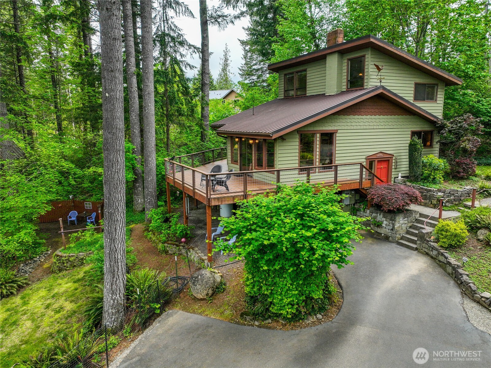 Unforgettable Paradise in Packwood’s Skyline area! Set on five lots totaling 1.43 acres, this private forest retreat offers space, comfort, and adventure just minutes from town. The 1,652 sq ft split-level home with daylight basement features 3 bedrooms, 2½ baths, and an attached garage. Enjoy windows galore bringing in natural light and peaceful forest views throughout. The open living area flows from the kitchen to the living room and out to the expansive deck, creating the perfect setting for relaxing or entertaining. The dining room also opens to the deck, offering another serene spot to enjoy the surrounding trees. Two bedrooms are located upstairs and one on the main floor, all with closets and lovely woodland views. The 1,200 sq ft detached double garage/shop provides exceptional workspace and storage. Additional features include cedar lap siding, metal roof, paved driveway, RV parking, and a propane generator that automatically powers on during outages. Downstairs you’ll find a den, laundry area, and attached single garage with work space & storage, adding even more versatility to the home. And for a touch of fun—there’s even a treehouse with loft and electricity, perfect for campouts and memorable adventures. Located just minutes from Packwood’s coffee shops, breweries, library, grocery store, post office, and more—about five minutes away as the crow flies—this remarkable property combines privacy, charm, and convenience in one incredible setting.