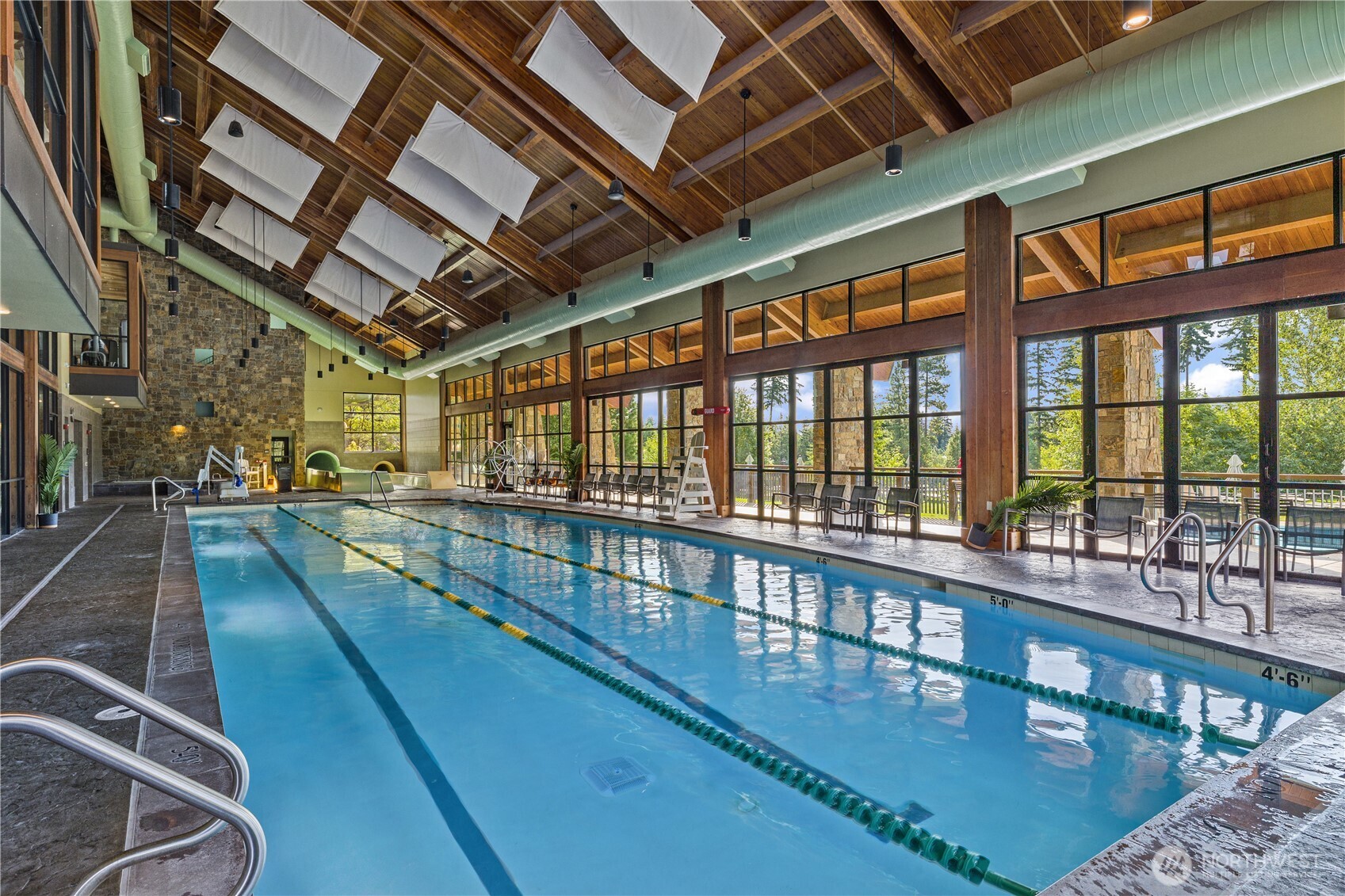 Suncadia Rec Center with indoor and outdoor pool, hottub, workout room, store for shopping and water slides. This pool open year round. This requires a membership fee